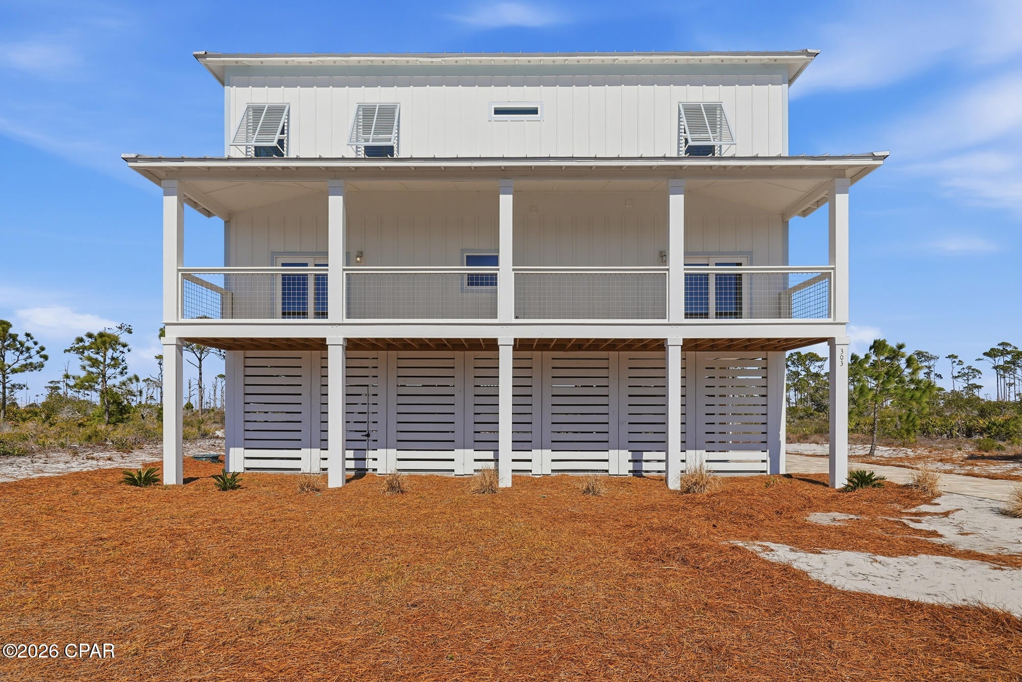 North Cape San Blas new construction on one of the most unique lots anywhere! Located in the gated community of Park Point at Secluded Dunes, this home literally is contiguous to the boundary of the T.H. Stone Memorial St. Joseph Peninsula State Park. This extremely rare setting also allows stunning views of St Joseph Bay (sunrises) and The Gulf of America (sunsets). Enjoy views of the conservation wetland area while bird and animal watching or take a stroll to the community pool only 120 feet away. When you have had your fill of these natural wonders, there is a beautiful oak canopy dedicated beach boardwalk/ access that meanders to one of the best North Cape Beaches via prestigious Secluded Dunes area. Features of the home include; Open floor plan with 10 foot ceilings throughout, Living room, dining room, 4 bedrooms, 3.5 baths with space that could easily accommodate up to 12 guests. Spacious kitchen with gracious counter space, stainless appliances and a pantry. 1st floor has double entry to a 46' wide screened porch for multiple uses and screened back porch. 2nd floor has a bonus room with mini fridge that opens up onto 23 foot wide open sun porch for breathtaking views of the State Park, Gulf, and Bay! Covered concrete parking area with room for 3 vehicles as well as brick paver driveway. Room for a private pool if desired in the back yard as well as a hot and cold outside shower. Bring your own decorating vision for this brand new and truly treasure of a location in order to live your coastal dream. Please see our matterport (3-D), amenities bullet point list, survey, drone footage, engineered structural plans, and certificate of occupancy in the additional documents. Some dimensions were obtained from the Gulf Co. Property Appraiser's office, please verify if important.