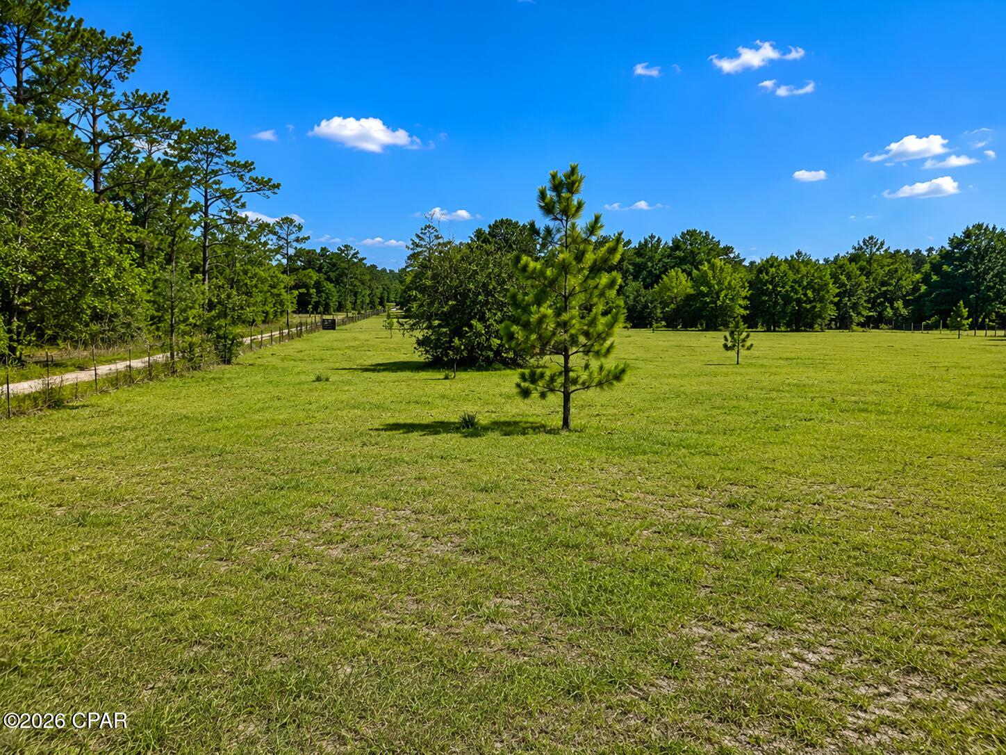 iscover the perfect blend of privacy, beauty, and opportunity with this exceptional 12.5-acre parcel in DeFuniak Springs. Fully fenced and predominantly cleared, this property offers a rare combination of open pasture and picturesque mature trees, creating the ideal setting for your dream home, family estate, mini farm, or recreational retreat. Properties like this rarely become available. The hard work has already been done with much of the land cleared, while the remaining beautiful trees provide character, shade, and a peaceful natural setting. Whether you're looking for room for horses, livestock, a custom home, or simply space to enjoy country living, this property offers endless possibilities. Conveniently located with easy access to DeFuniak Springs while still providing the privacy and tranquility that acreage buyers are searching for, this is a unique opportunity to own a truly special piece of Florida countryside. Buyer to verify all dimensions, zoning, permitted uses, and any information deemed important. Some listing photos have been virtually enhanced to illustrate the property's potential and may not represent current conditions.