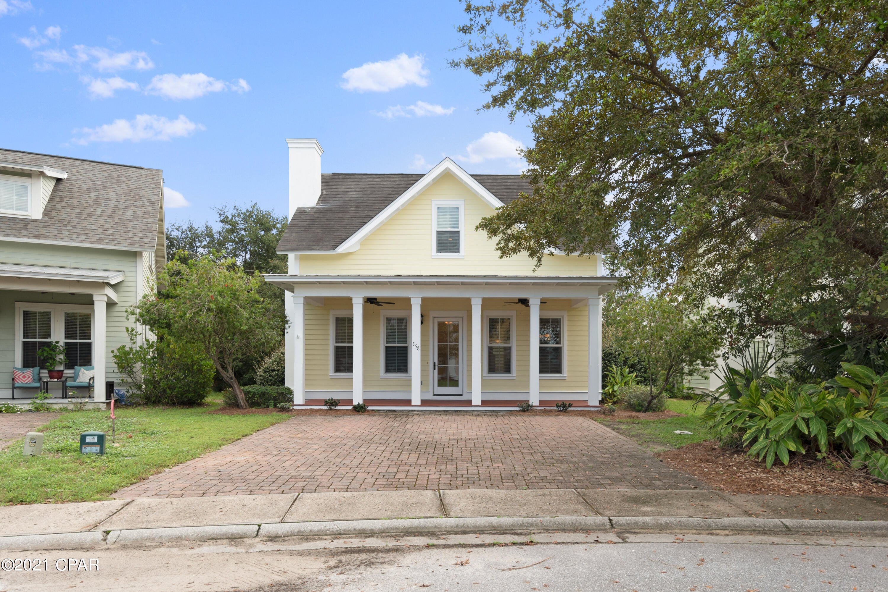 Beautiful 4-bedroom, 3.5-bath home in Harrison's Walk, a great community close to the beach. Incredible price for a home this spacious and close to the Gulf of Mexico! This home has great curb appeal with a covered front porch and brick paver driveway. Interior offers beautiful tile floors throughout the common areas, raised ceilings, and great natural light. Craftsmanship details like crown molding and white wainscoting give the property a beach cottage feel. This is a fantastic open floor plan with a ground floor master bedroom for added convenience and three guest bedrooms on the upper level. Great kitchen with wood cabinets, expansive granite countertops, and a breakfast bar with pendant lighting. All bathrooms feature granite as well. There is plenty of seating with a formal dining area off the kitchen as well as a breakfast bar and open dining area. The master bedroom is conveniently located downstairs and is very spacious with an en-suite bathroom. The master bath features a double vanity, granite countertops, and a shower/tub combo. There are three guest bedrooms upstairs, one with an en-suite bathroom and the other with a shared bath. There is also a great flex space at the top of the stairs with hardwood floors that could ideally be another living area, lounge or office. If you are looking for a home close to the beach with nice privacy, this is it! The community does not allow short term rentals, making this home the perfect primary residence or long term rental (6 months+ required). Harrison's Walk offers a nice community pool and is close to many great attractions & conveniences.