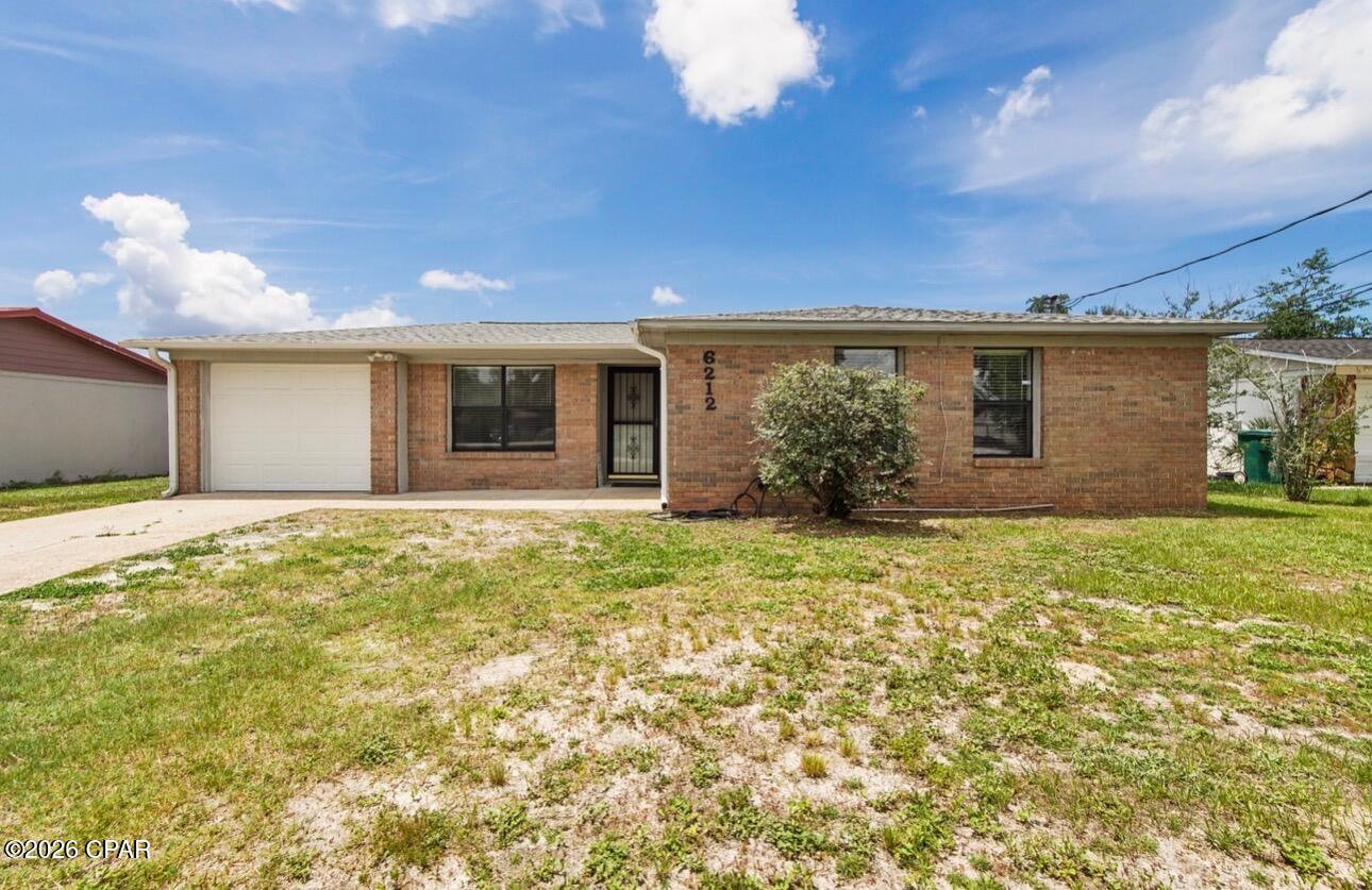Welcome home! This is the perfect starter home in a prime location -- and the SELLER IS MOTIVATED AND READY TO GO!

3-bedroom, 2-bathroom home with an attached garage is just a hop and a skip from Tyndall AFB and conveniently located right off Tyndall Parkway -- putting shopping, fitness centers, and some of Bay County's best multicultural dining all within easy reach.

Step inside to find brand-new carpet in all bedrooms and tile flooring throughout the main living areas, creating a clean, low-maintenance feel. The seamless indoor-outdoor flow leads out to a large, freshly re-screened back porch -- perfect for relaxing or entertaining year-round. The oversized, fully fenced backyard offers plenty of space for pets, play, or future projects.

Additional updates include modern patio doors with built-in blinds between the glass, adding both style and convenience.

Schedule your showing with your favorite Realtor today! Being THE MOST AFFORDABLY PRICED 3/2 home over 1000 sq ft in the area, it is priced to sell and will not last long! Measurements assumed to be correct- if important, buyer MUST VERIFY!