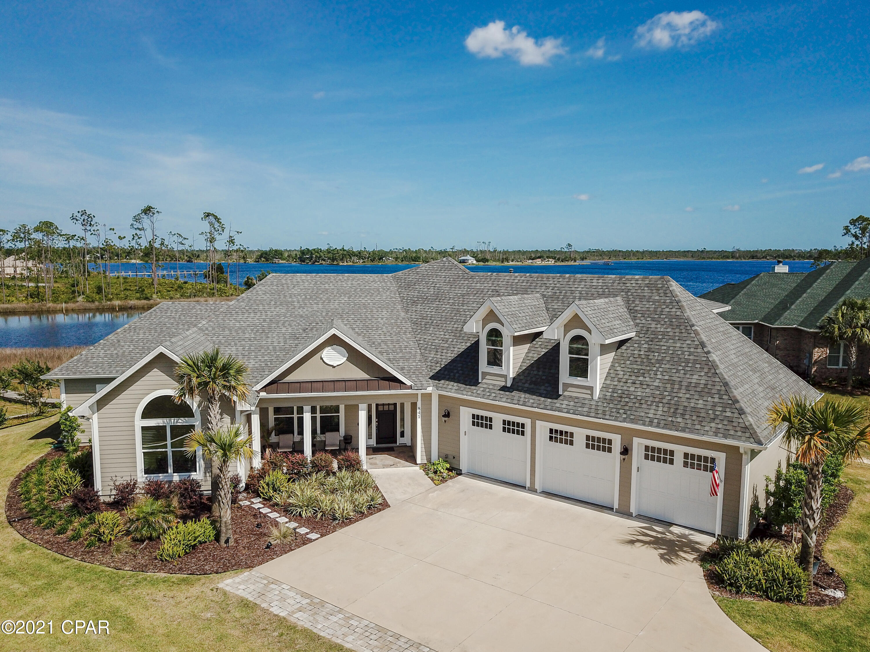 CURRENTLY UNDER CONTRACT, SELLER ACCEPTING BACKUP OFFERS.  Stunning Custom Built Waterfront Home with access to the Gulf-Of-Mexico, featuring a Screen-Enclosed Heated Pool, Outdoor Entertaining Area, 10,000LB Boat Lift, Dock, Floating Dock, and Boat House, all on a private double lot, 1.3 ACRES, just waiting on the right buyer!  If you have ever dreamed of owning a piece of paradise, look no further, here it is!  The interior is custom built head-to-toe.  There is too much to mention so you must look at the pictures and walk-through video for a full understanding of the amount of detail this home has.  Starting in the custom gourmet kitchen, featuring a pass-through window where you can hand food through to the outside bar/grilling area, Monogram professional gas range with a dual oven, GE stainless steel dual icemaker refrigerator, granite countertops, under cabinet lighting, large granite island, ample cabinet space, built in desk, wine refrigerator, and even a walk-in pantry that is 8.11x9.9.  The mud room off the kitchen and is 8.11x8.10 with built in cabinets, shoe organizers, and storage closets.  Where do I start with the living room, which overlooks the Bayou...First, the stackable glass sliders open up to reveal the screen enclosed pool and entertaining area, where you can take in the beautiful bayou, and the peace & serenity it will bring you.  The living room has a vaulted beamed ceiling, built in cabinets, and the flooring throughout this home is true high-end wood flooring, with tile in the bathrooms.  The master bedroom sits on the water side with a beautiful view, and the master bathroom is one that most people dream off.  Sit back in your claw tub, overlooking the enchanting bayou, or take a shower in the walk-in shower with a sauna/steam feature. The his & her separate vanities are a wonderful feature, but the 11.5x9.9 walk-in closet, with built in organizers, complete this custom master en-suite. For added convenience, the laundry room is accessible from the hall, or directly from the master closet, making it easy to put away the laundry.  The 2nd bedroom is to the front of the home and features a custom walk-in closet.  The first level also features an office with built in cabinets, which could be used as a 4th bedroom.  The upstairs is another large en-suite, overlooking the bayou, and has a private bath, and custom closet.  There are water views from all the rooms along the back of the homes. The outside entertaining area is truly one of the best features of this home.  With a newly installed pool heater (2021), you can swim all year long in the salt water pool featuring a waterfall, and tanning ledge.  The fully enclosed brick paved pool and patio area is a perfect place to entertain.  There are multiple sitting areas where you can take in your favorite sports game, while cooking dinner on the outdoor kitchen grill, while passing food and dishes through the pass-through window for added convenience.  On those hot days you can turn on the misting hose, which runs along the length of the back patio.  This area will truly make you feel like you are on vacation all year long. If you are a boater, this is the home for you. The boat dock will lead you to a 10,000lb lift that will accommodate up to a 22-24 ft. boat, and also has water and electricity, along with a lounging dock, and a floating dock so you can easily get into the water with your kayaks and paddle boards. Did I mention the WHOLE HOME GENERAC GENERATOR, which will provide peace of mind when there is a power outage?   The oversized 2-car garage, with a golf cart garage, currently has a workstation, hosts the Culligan high efficiency water softener, and has two extra storage areas allowing for plenty of room for storage, in addition to the pull-down attic space.  If you are not familiar with Laird Bayou, it is a gated waterfront community with a community pool, and offers gated storage for owners to store RV's, Boats, Trailers, and also has a private boat launch to accommodate larger boats.  There is so much more I can say about this home but you must view it to appreciate the custom detail it has. Additional Features include: Lush Landscaping, Security Camera's, every room has its own Nest thermostats to control the heat/air, and all can be controlled from an app, including locking doors, and opening the garage door.  If this sounds like the home you have been waiting on contract your Realtor for a private showing!  Age, Sq.Ft., Room Dimensions, Taxes, schools, or any information in this listing, if important, must be verified by the buyer via personal or professional inspection.