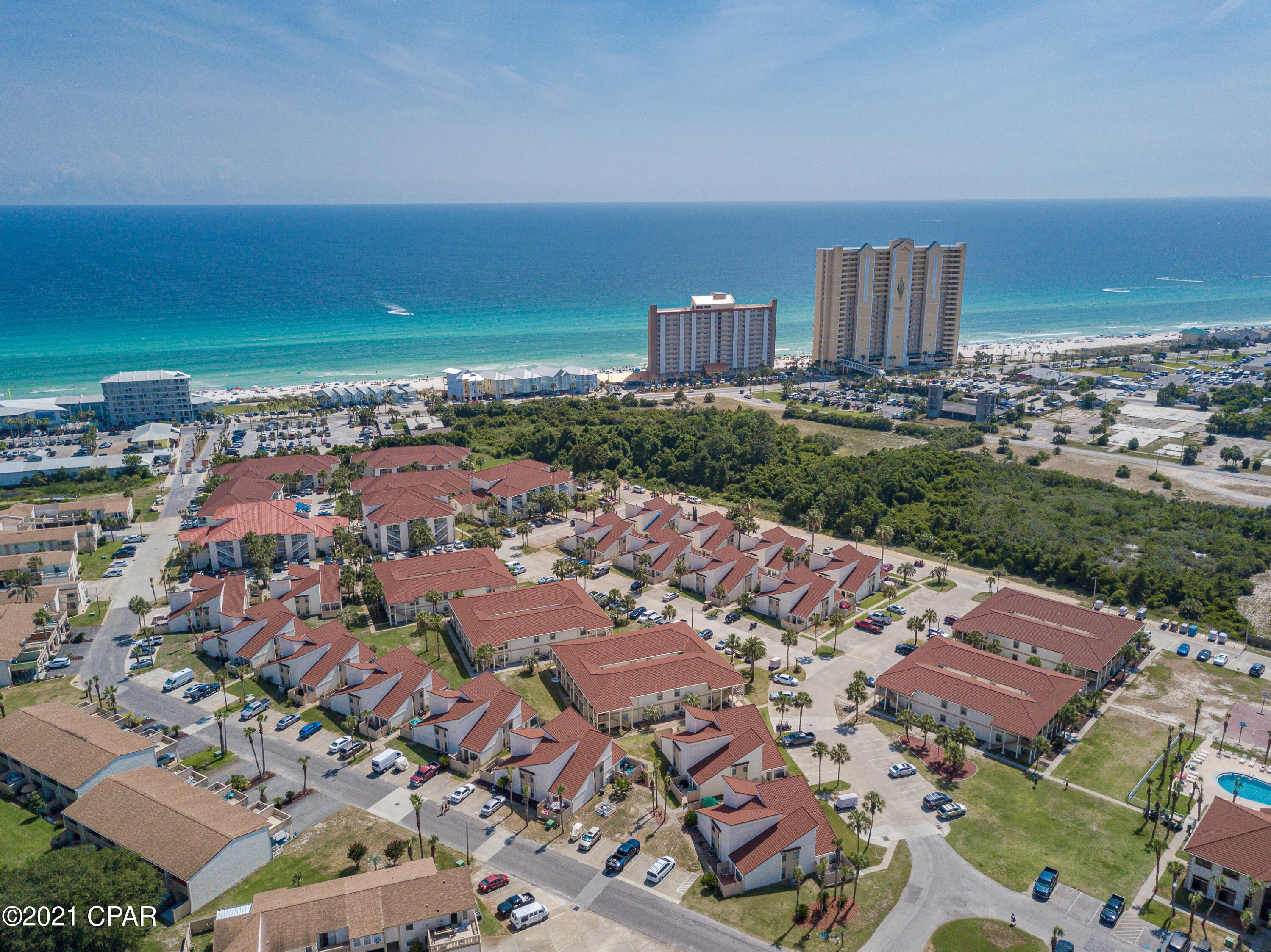 Gated golf cart community, walking distance to the beautiful white sand beach. This building is one of the closest to the beach. Great retirement or rental condo. This is a 2 bedroom 2 bath condo has the master bedroom on the first floor. Decorated beautiful & many updates to include granite & newer appliances.   Amenities include gulf access, pools, tennis, shuffle board and clubhouse.Owners pets are allowed.Rentals for 2021 thru Labor Day is $19,250 gross.Owner is reviewing highest & best offers 6-21-21