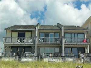 Back on the market at reduced price!!! ''No Fees'' Gulf Front 3 bedroom 3 bath townhome. Featuring large living/dining area. kitchen, guest bedroom and bath downstairs, two bedrooms and two bathrooms upstairs and a ''bunk room''. This unit has outside storage, loads of closet space and is a great rental property. Located on the west end of panama city beach, this property has dynamite view of the Gulf of Mexico. Walk out your door and be on the beach. Close to 84 beach access. Age, SF and Room Sizes are approximate. Please verify if important.