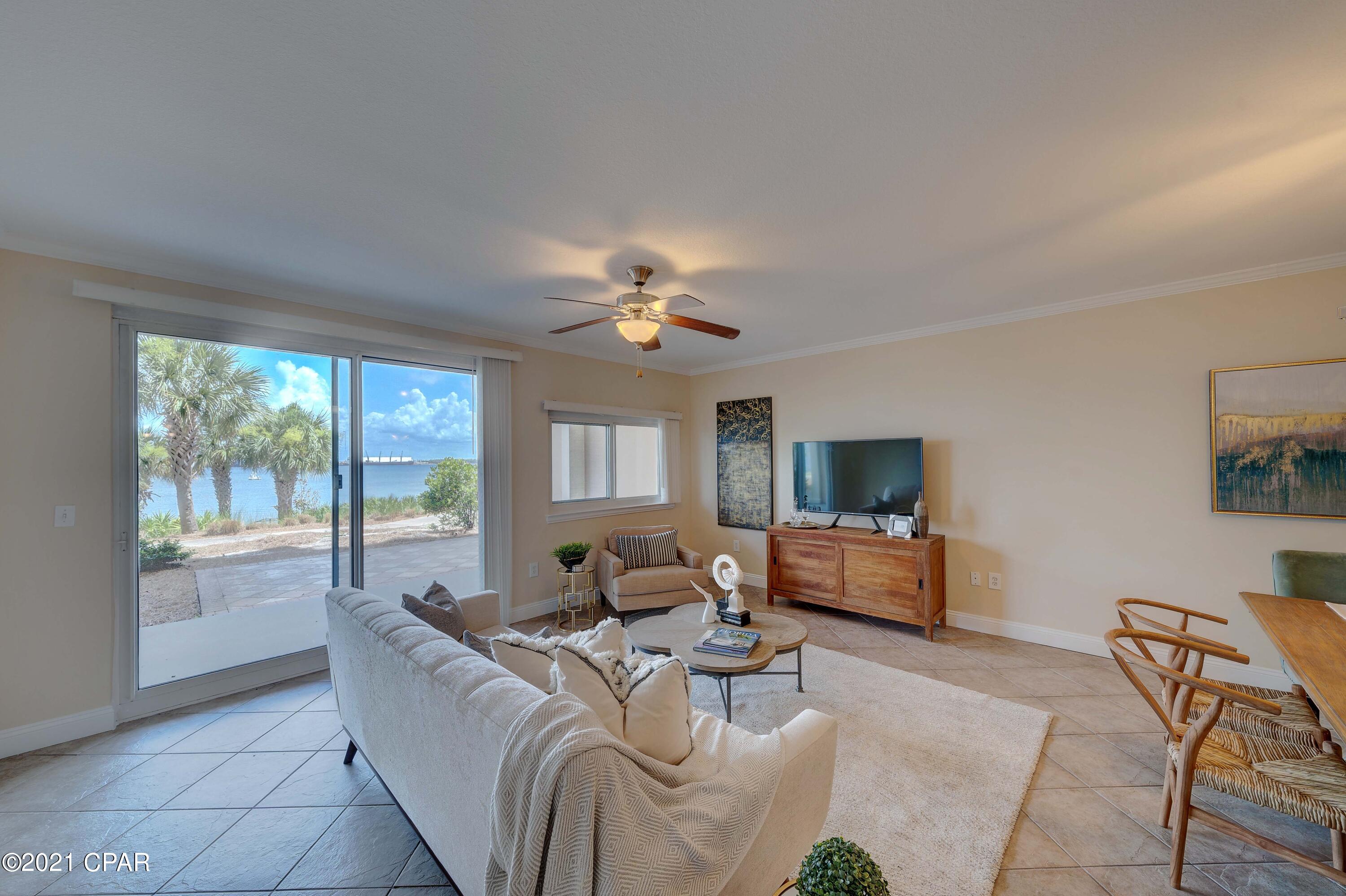 CURRENTLY UNDER CONTRACT, SELLER ACCEPTING BACKUP OFFERS. Waterfront condo with 3 bedrooms and 3 full baths plus an office or 4th bedroom!  This is the perfect location in Magnolia Bay!  Enjoy the convenience of first floor living - your own personal parking spot is literally steps away from your front door.  Open the door and see all the way through to your view of the bay. Enjoy an open concept layout and easy one story living.  Step outside to your back patio and you have an awesome view, and also easy access to the bay.  You have water views from your master bedroom, living room, dining area, kitchen, and back patio!  Magnolia Bay Club is a gated neighborhood and has fabulous amenities including your bay front pool, gazebo, grills, beach area, paddleboard area,, dock, gym, club room.