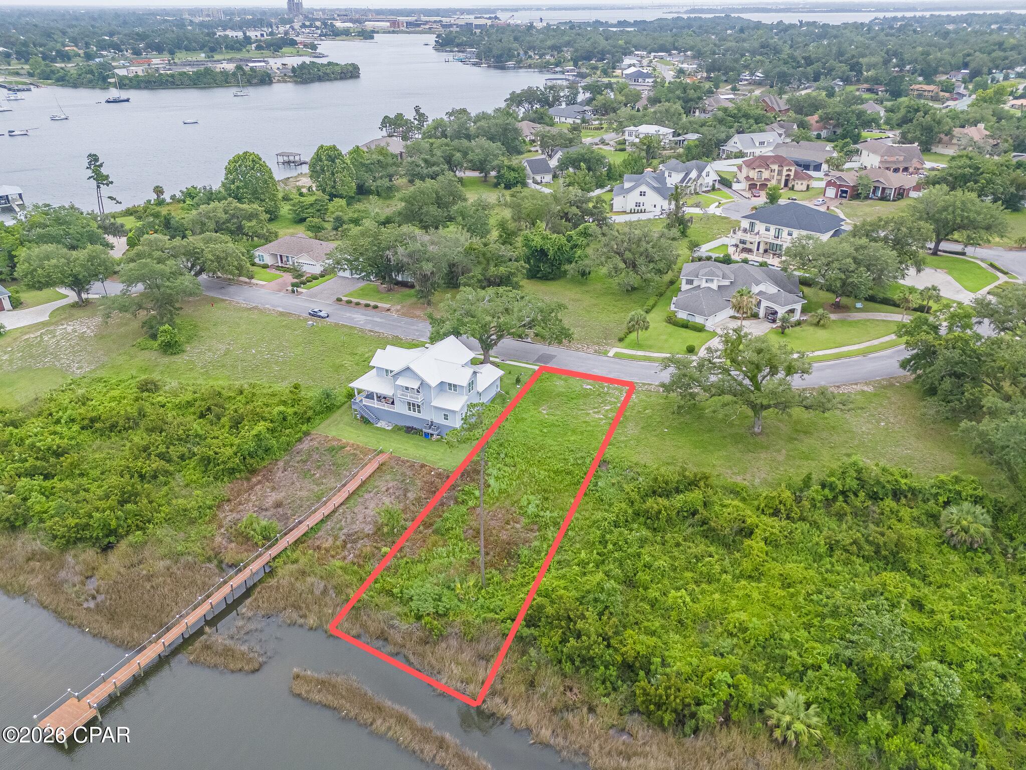 'CURRENTLY UNDER CONTRACT, SELLER ACCEPTING BACKUP OFFERS'
Build your dream home on this exceptional 0.365-acre waterfront homesite in the highly sought-after Cove Pointe community of Panama City. Nestled along the shores of Watson Bayou, this beautiful lot offers access to a navigable waterway leading directly to St. Andrews Bay, the Intracoastal Waterway, and the Gulf of Mexico, making it an ideal location for boating enthusiasts. Known for its mature hardwood trees, elevated topography, and charming waterfront setting, Cove Pointe is one of Panama City's most desirable neighborhoods in Panama City. Residents enjoy a peaceful coastal lifestyle while being just minutes from downtown Panama City, marinas, dining, shopping, medical facilities, and the St. Andrews Bay Yacht Club. Whether you're planning a custom primary residence, vacation home, or waterfront retreat, this rare homesite presents an outstanding opportunity to build in an established community that perfectly blends natural beauty, convenience, and access to some of the area's best boating and waterfront amenities. Buildable footprint minus setbacks, is 80 x 80.