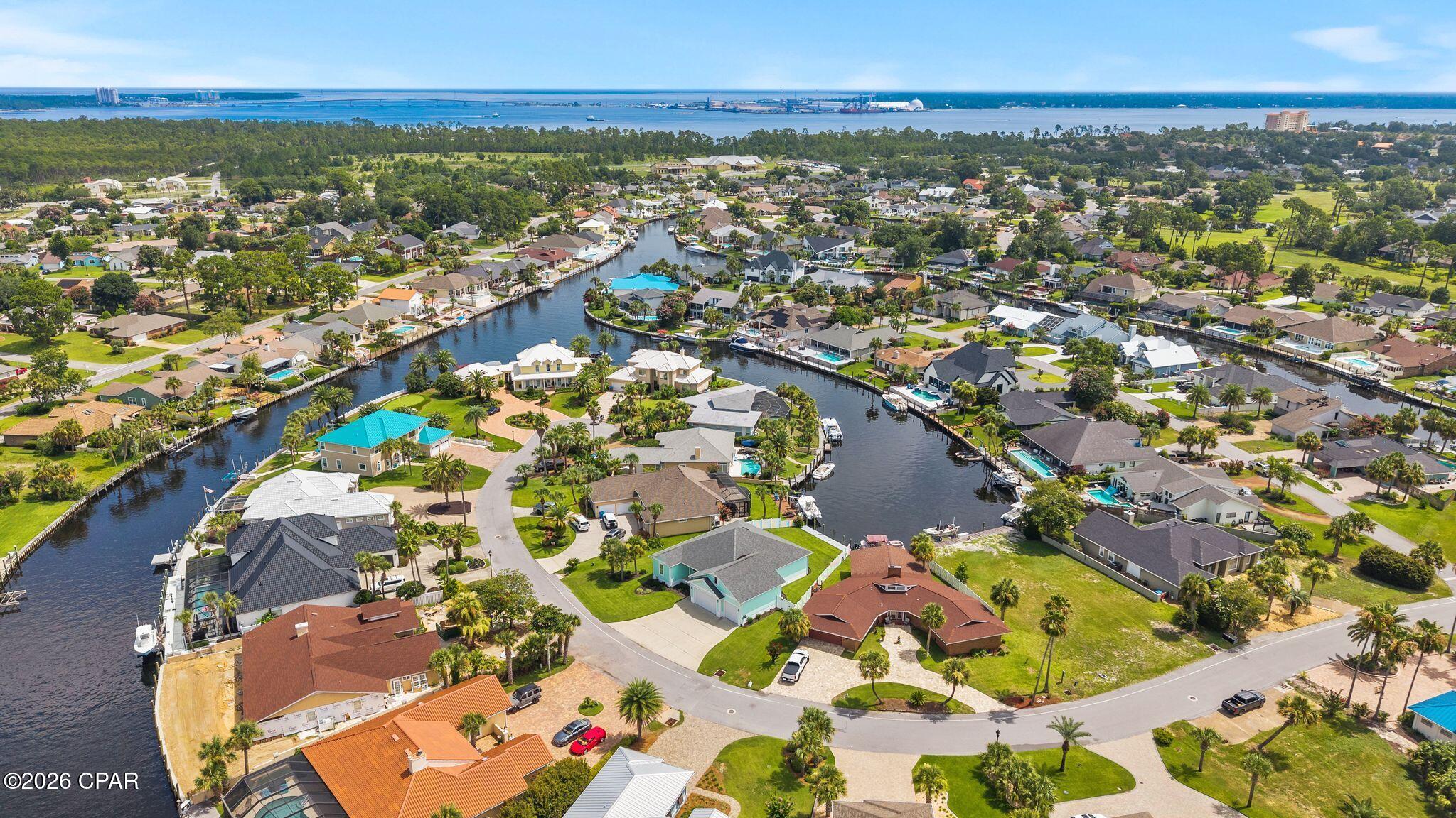 Water toys and Garage storage. This beautiful canal front home was built in 2020 by Stacey Wilson using updated FL. Codes. The open floor plan with 12' sliding glass doors, practically erases the line between the inside and out. Moor your boat along the new 44 foot dock and seawall completed in 2024 and grill the day's catch on your expansive covered deck overlooking the canal. Inside you will enjoy the easy flow between the entertaining living room and your nicely equipped kitchen complete with propane fueled stove, oven and on demand Rinnai water heater. All of which are connected to a buried 250 gal propane tank. This beautiful home has 3 bedrooms, 2 full bathrooms and 1 half bath. 10' ceiling, 8' doors, trey ceilings in the primary bedroom and living room. The use of the large upstairs bonus room is open to your imagination. Add in the 24ft deep garage with overhead storage and 9' doors that allow for large trucks and other oversized toys, and you have the ultimate family home for Florida fun in the sun. New HVAC was installed by A Superior in 2024.