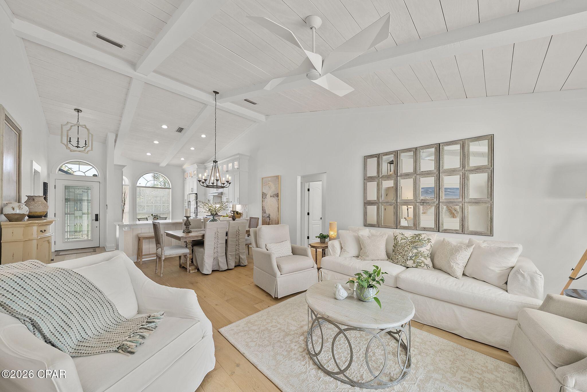 'CURRENTLY UNDER CONTRACT, SELLER WILL CONSIDER BACKUP OFFERS' Welcome to a stunning, immaculate, fully transformed, turn-key residence including private swimming pool and hot tub located on the the highly sought after west end of the beach.  Classic charm meets modern luxury. No expense was spared in this top-to-bottom renovation, offering peace of mind with new major systems and upgrades. Inside, the home boasts spectacular custom craftsmanship, including rich hard wood floors, a striking custom stone gas fireplace, and architectural wood ceilings with exposed beams. The gourmet kitchen is a chef's dream, featuring custom cabinetry with lighting, beautiful backsplash, quartzite counter tops, stainless premium GE Cafe high-end appliances, and elegant custom moldings that run throughout the home. Both bathrooms have been completely remodeled from the ground up with designer tile, contemporary fixtures, vanities and master shower.  HVAC 2020, Water Heater 2021. New outdoor Shower. New pool pump and filter system.  Pool retiled.  Plumbing.  New landscaping, white vinyl fencing, sprinkler system, well, All new high density foam insulation in attic, gutters and freshly painted inside & outside.  Taken down to the studs with high end upgrades.  Just a few blocks to the sugary white sand beaches and emerald coastline.  Easy access to fine dining, shopping, airport and outlet malls.  Don't miss out on this Fabulous Home!  Ask your agent for a list of all of the fabulous upgrades.