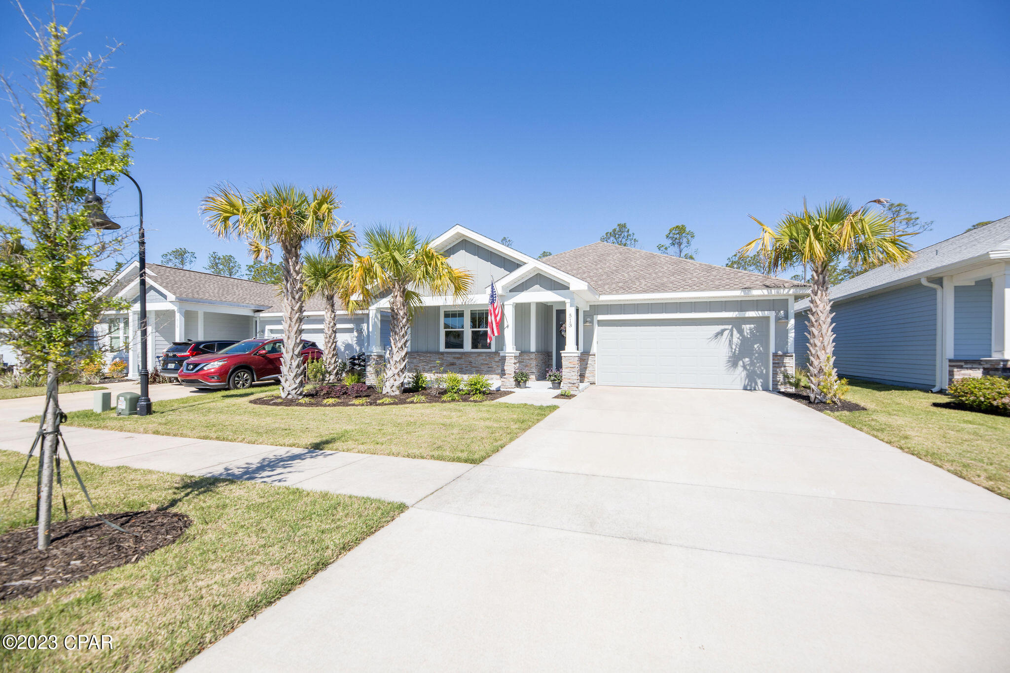 Washer, dryer, refrigerator and termite bond included in this brand new construction without the new construction wait in the established portion of the Breakfast Point neighborhood! This beautiful, well taken care of, Shearwater Gold floorplan home was built in 2021 and looks as new now as the day it was finished! Built by Southern Coastal Homes, it is a 3/2 home with a two car garage and large backyard that backs up to preserve land and is close to TAFB, the world's most beautiful beaches, shopping, schools, and all the rest Panama City Beach has to offer! Inside, the features of this coastal inspired home include a large foyer entrance, wide open Great Room and floor plan, chef's kitchen with 4 burner gas cooktop, center island, custom cabinetry with soft close drawers and stainless steel appliances, tray ceilings in the master suite and living area, huge tiled shower, double vanity and very large walk-in closet. The large covered patio and quiet backyard just off Great Room makes this home perfect for entertaining. Outside - This home features a 2 car garage, covered lanai, covered front porch, fully landscaped yard with Rain Bird sprinkler system. This home includes upgraded finishes including Luxury vinyl plank flooring, custom cabinets, quartz solid surface counter tops, tile back splash, Whirlpool stainless steel ''Gourmet Kitchen'' appliances, stainless sink, transferrable termite bond, and much more! Do not wait to schedule your showing and live the Florida Coastal Lifestyle!