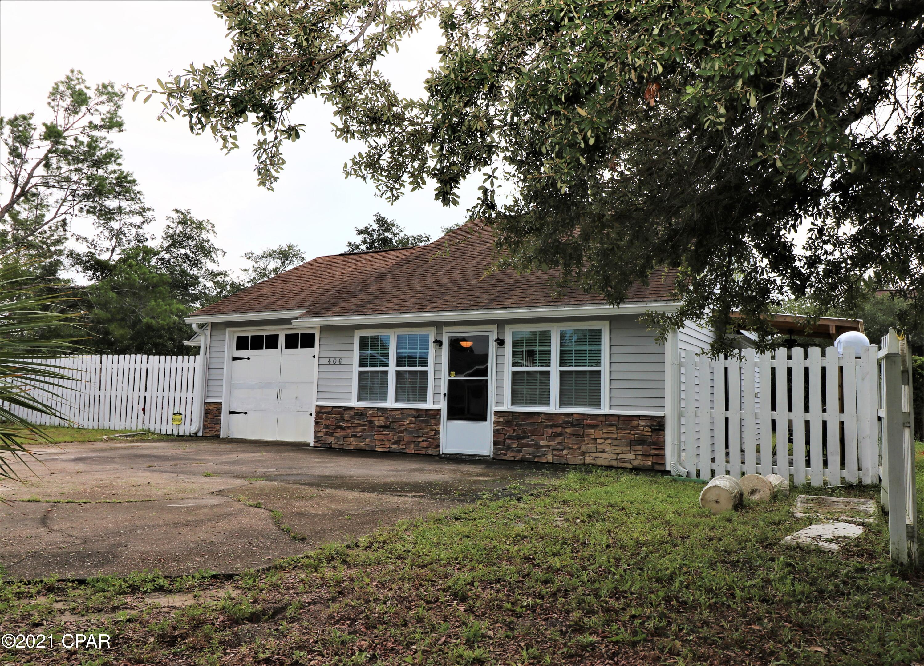 CURRENTLY UNDER CONTRACT, SELLER ACCEPTING BACKUP OFFERS Super Cute 3 bedroom 1.5 bath home on a large corner lot on Panama City Beach, but in the County! This home is conveniently located to all things Bay County and just minutes to the Navy Base and the Beautiful White Sands of Panama City Beach! Large corner lot, fenced, double gate on the left side of the home and on the corner of the lot so you can easily pull through your Boat, Camper or whatever your choice of toys are to be parked! This awesome home features but not limited to: camper sewer hookup, completely furnished to include washer/dryer, dishwasher in 2021, refrigerator 2020,mostly new/newer windows, underground power, wired for satellite system but just needs your dish, and security system with Bay County Alarm System. All information should be verified if important.  Call your favorite Realtor to schedule your private showing right away as this will not last!  Thank you for considering this property!