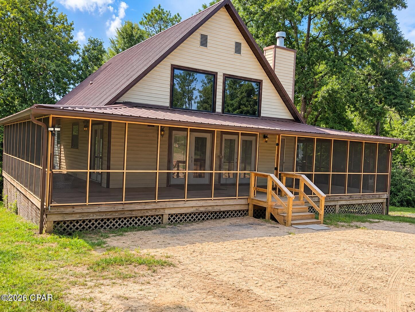 Need that little bit of Privacy and Country Setting?  This is the Home for You.  Including the Completed Basement for that 4th Bedroom and 3rd bath, this home has approximately 2,100 Sq Ft of Living Space.  If you love that Florida Living, you will love the woods surrounding the home and the stream on the back side of the property!  The large Screened porch is a great place to relax and enjoy nature.  This home has been updated with new carpet and Luxury Vinyl Plank flooring.  There are a few cool evenings that you can enjoy that woodburning Fireplace!  There is an Optional POA (Property Owners Association) but no building restrictions.  The  Optional Annual POA allows you access to a few amenities and the Club House by Compass Lake.  Call today to see this home.  It won't be on the market long!