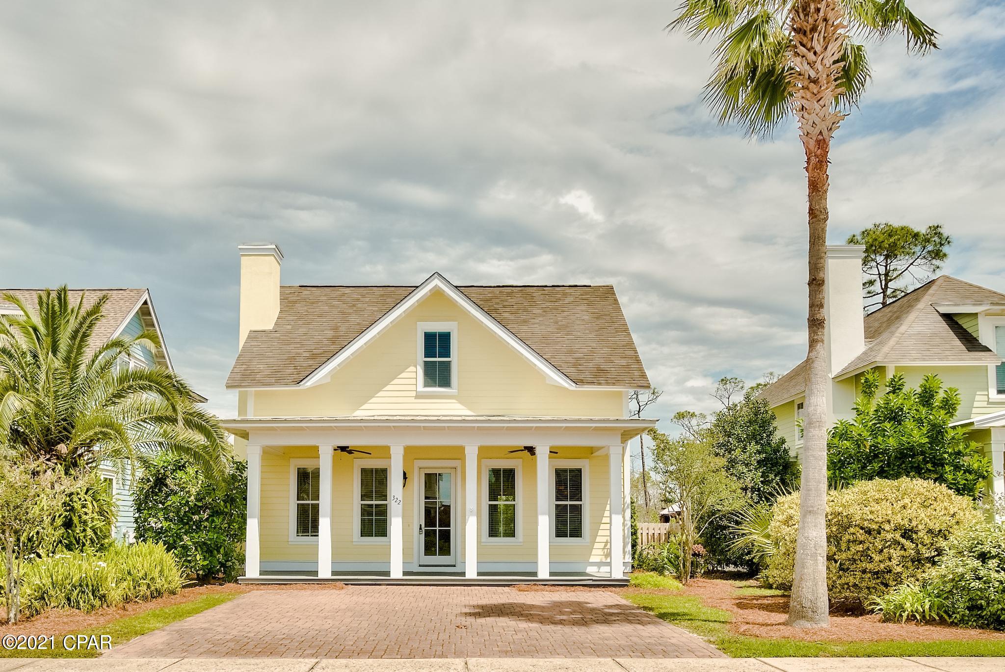 Beautiful 4-bedroom, 3.5-bath home in Harrison's Walk, a great community close to the beach. Incredible price for a home this spacious and close to the Gulf of Mexico! Fresh paint throughout and brand new carpet. This home has great curb appeal with a covered front porch and brick paver driveway. Interior offers beautiful tile floors throughout the common areas, raised ceilings, and great natural light. Craftsmanship details like crown molding and white wainscoting give the property a beach cottage feel. This is a fantastic open floor plan with a ground floor master bedroom for added convenience and three guest bedrooms on the upper level. Great kitchen with wood cabinets, expansive granite countertops, and a breakfast bar with pendant lighting. All bathrooms feature granite as well. There is plenty of seating with a formal dining area off the kitchen as well as a breakfast bar and open dining area. The master bedroom is conveniently located downstairs and is very spacious with an en-suite bathroom. The master bath features a double vanity, granite countertops, and a shower/tub combo. There are three guest bedrooms upstairs, one with an en-suite bathroom and the other with a shared bath. There is also a great flex space at the top of the stairs with hardwood floors that could ideally be another living area, lounge or office. If you are looking for a home close to the beach with nice privacy, this is it! The community does not allow short term rentals, making this home the perfect primary residence or long term rental (6 months+ required). Homes on the street rent for approximately $2,300 per month for long term tenants so this is a fantastic investment also. Harrison's Walk offers a nice community pool and is close to many great attractions & conveniences.