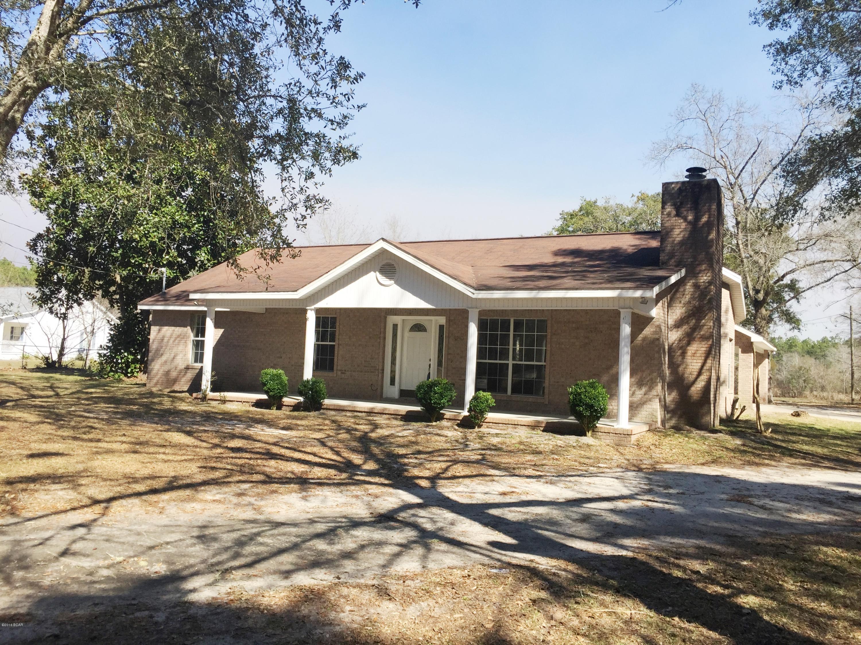 Solid brick home situated on two beautiful acres of land in a great location! You're just enough out of the way to feel free from traffic and congestion but close enough to town to not have to travel too far for shopping and restaurants. This home has a great floor plan. The kitchen is large and open to the dining and living room areas. The master bedroom is spacious. There is an oversized 2 car attached covered parking area as well as a yard building which could handle another car inside, and another covered parking spot!  The land is all fenced with lots of wide open spaces and adequate shade trees. Come bring your horses, your boats, your RV's and enjoy the best of Florida living!