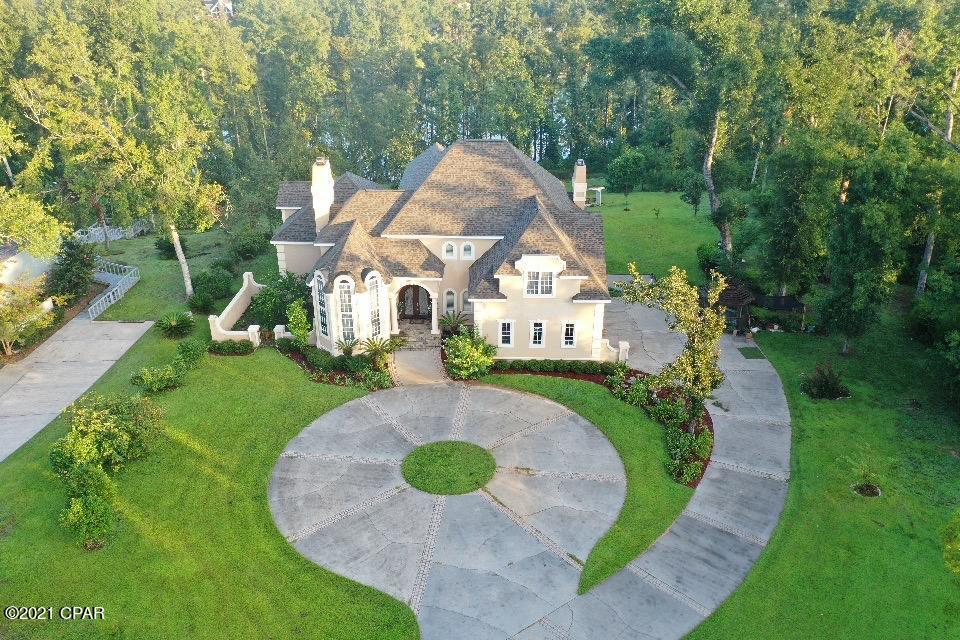 Once described in a magazine as the ''Mansion on the Mill Pond'' this elegant waterfront home has it all. An Italian style home that's nestled on a beautiful 4 mile long spring river that starts at a first magnitude spring called Blue Springs. This elegant home features barrel celling that stretch from the foyer to the dinning room.  Spacious 4 bedroom, 4 full baths, with 2 half bathrooms and a shower.  This home was formulated in the Capistrano style by Sholtz Design of Ohio with impressive architecture that dominates the remainder of the home as illustrated in the coffered ceilings, elaborate molding and curved entryways.  The study offers some of the most dramatic examples of the homes character.  With mahogany walls and an army of windows and cathedral ceilings. Call today!!