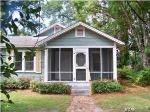 A Charming 2 bedroom 1 bath home located in the heart of Port St Joe Florida. Walking distance to the Bay. Close to schools and downtown. Wonderfully landscaped yard with beautiful azaleas and large hardwoods. The home has been updated but has kept the old world charm. There is a screened in front porch that leads into an open living room with polished hardwood floors. The home boast an open floor plan with a considerable kitchen and plenty of cabinet space. There is covered parking in the back of the home with a small closet for your tools. This would make a great first home or a vacation home. This is a Fannie Mae Homepath Property. Call your Realtor today to schedule a viewing. All measurements are approximate. Please verify if important. YEAR BUILT MAY NOT BE CORRECT. THIS IS THE