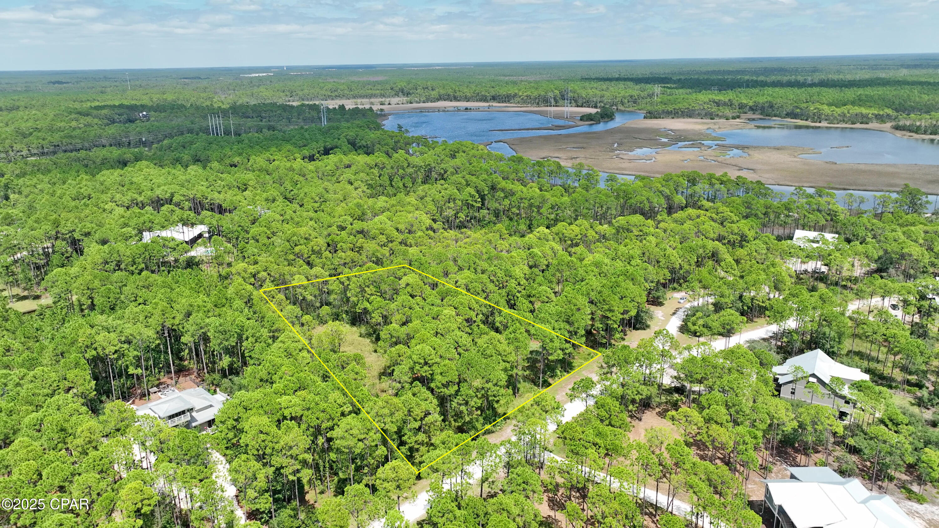 Build your dream retreat on this spacious 1+ acre lot in the exclusive RiverCamps community, nestled along scenic Crooked Creek with direct access to West Bay. Enjoy unmatched amenities including a private boat launch, day docks, and a protected boat basin perfect for kayaks, skiffs, and jon boats.

Residents also have access to a creekside campsite with tents, a fire pit, and bathhouse, plus 7+ miles of trails and boardwalks ideal for walking, biking, and exploring nature. Surrounded by preserved land and rich in wildlife, RiverCamps offers a rare blend of privacy, adventure, and coastal living, just minutes from Panama City Beach.