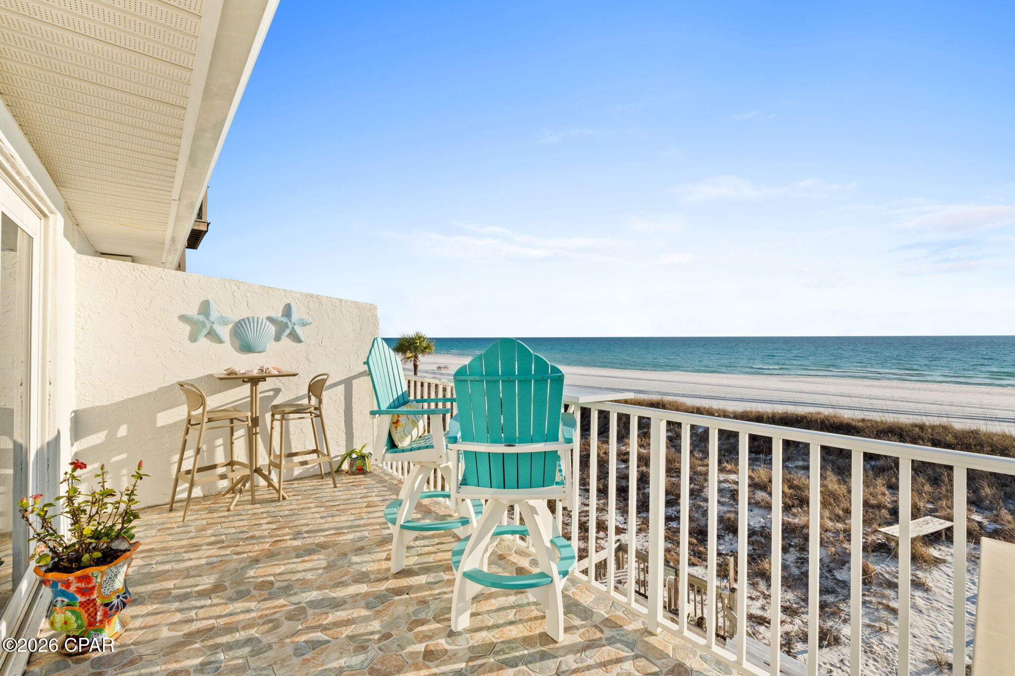 Gulf-Front Living at Its Finest - On the Beach! Experience coastal paradise from this rarely available gulf-front, low-rise condominium located on the 2nd floor (top floor), just steps from the sugar-white sands and surf of the Gulf of Mexico. Wake up to the soothing sound of waves and water views from your private balcony — the perfect place for morning coffee or evening sunsets. Inside, enjoy an open, light-filled layout with thoughtful updates throughout. The kitchen and living areas flow seamlessly, ideal for both relaxed living and entertaining guests. Amazing wood-like tile through the entire home. The kitchen boasts beautiful cabinetry, a copper apron sink, and stunning quartz countertops. Also matching copper backsplash and a high-end Whirlpool appliance package.  A spacious en-suite with walk-in-closet. Currently a permanent residence and pride of ownership shows throughout. Previously a 2 bath and owners coverted to 1 bath, could easily be changed back and owners have the matching flooring.on the second story offers elevated views while still providing easy access. The current owners have the living space set up as the master bedroom to wake up to the view! This well-maintained condo is part of a low-density community that enhances privacy and charm while placing you in close proximity to local dining, shopping, and entertainment options. It may have the lowest association fees that you will find anywhere. Hvac and water heater are less than 4 years old. Whether you're seeking a permanent residence, vacation escape, or investment property, this Gulf-front gem delivers unparalleled beach lifestyle living. Don't miss your chance to own a piece of coastal bliss!