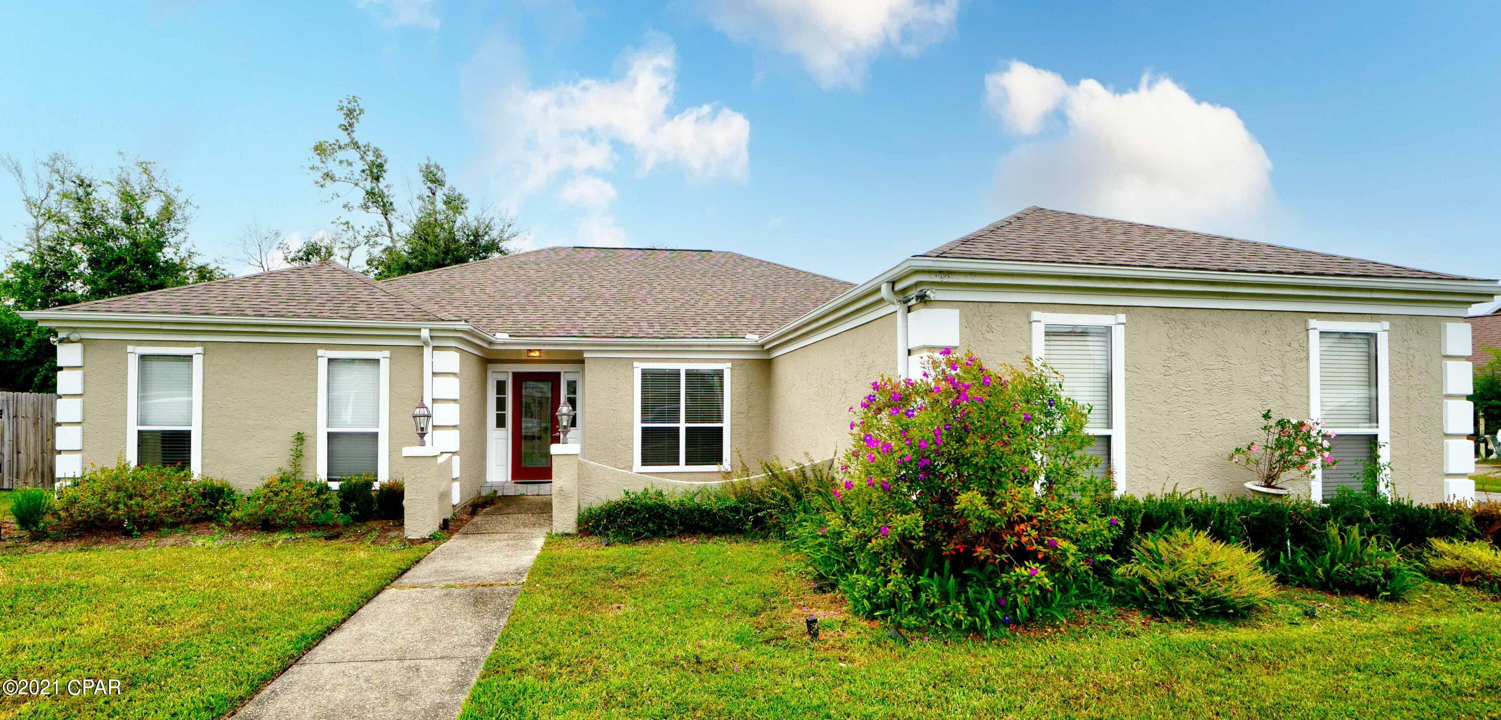 CURRENTLY UNDER CONTRACT SELLER TAKING BACKUP OFFERS -- GREAT LOCATION Forest Park ... easy access to Lynn Haven, Panama City, beaches, and points beyond.  As you enter this one-story 2213 SF home (split floor plan) you are greeted with a formal living area with a view of the open floor plan that includes a very large kitchen, dining area and den.  The kitchen features plenty of cabinet space, an island with cook stove, and a double-sided refrigerator with ice maker. Between the dining area and den there is a see-thru wood burning fireplace. There are four bedrooms, one with a private entrance. The large master suite has easy access to the master bath that features a jetted garden tub, double vanity, his/her closets with mirrored doors, a separate shower, and water closet. There is a large laundry room, full bath and two bedrooms on one side of the house. There is crown molding and tiled floors throughout. Along with a double-car garage there is a separate large one- car garage with plenty of extra storage space or a work shop. The back yard is fenced with a double entry gate. A designated patio area for your hot-tub with available electric. New roof after Hurricane Michael and this home has gutters.
