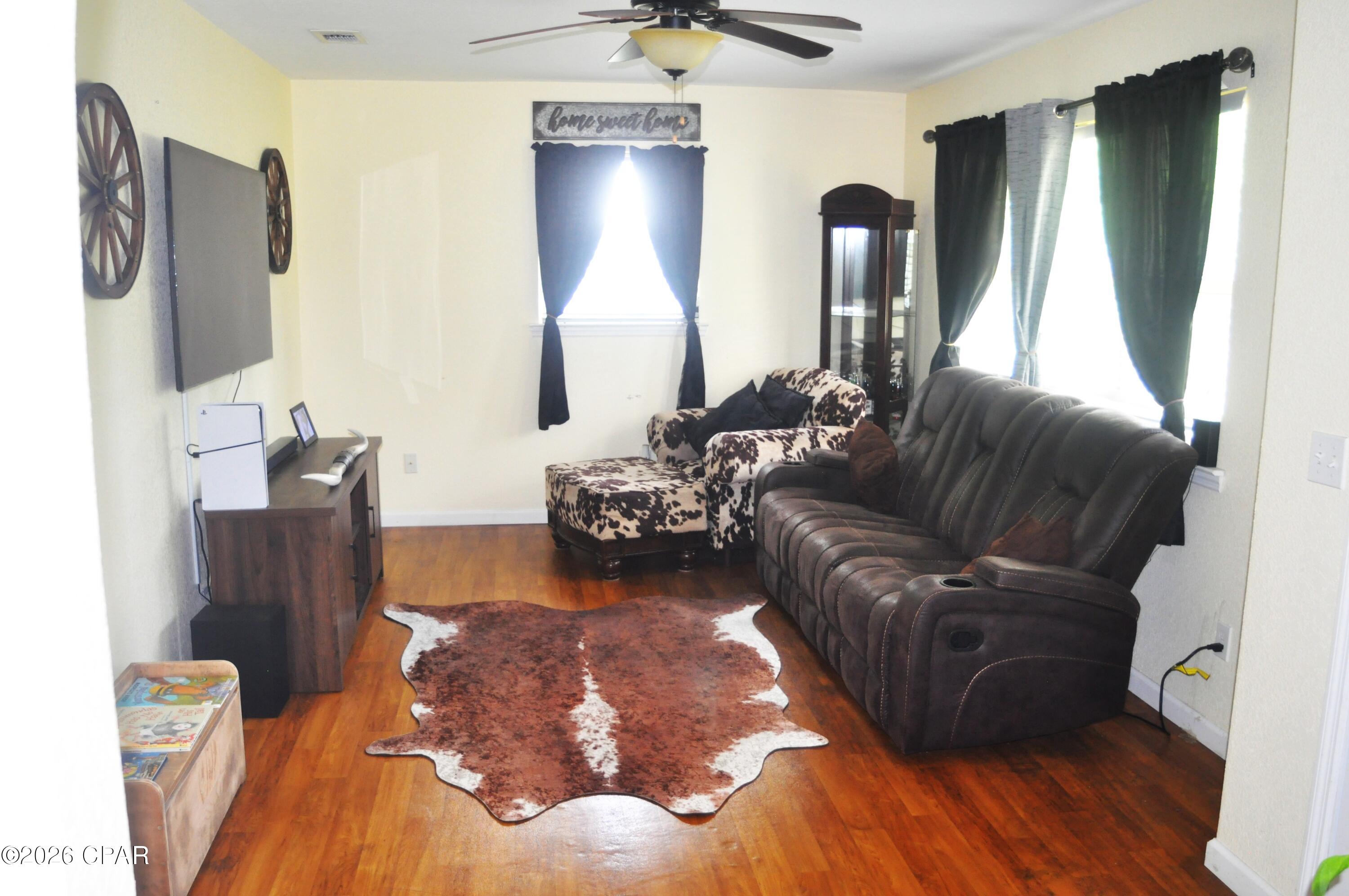 Move in Ready cozy country living and Beautiful 4 Bedroom Home Only 5 miles to be fishing on the Chipola River Wildlife Management Area. 1 ac all cleared plenty of romm for the kids to ride the 4 wheelers and go carts. Nice garden area in the back. Fireplace with swing to enjoy your quite evenings. Large sunroom ro use as a playroom , craftroom or pool table area. The 4th bedroom could even be a mother in law suite as it has its own bathroom, Locate in Altha just 10 minutes to I-10 and all the shopping and restaurants you need.  Big storage shed also.  USDA, VA FHA financing availabe.
