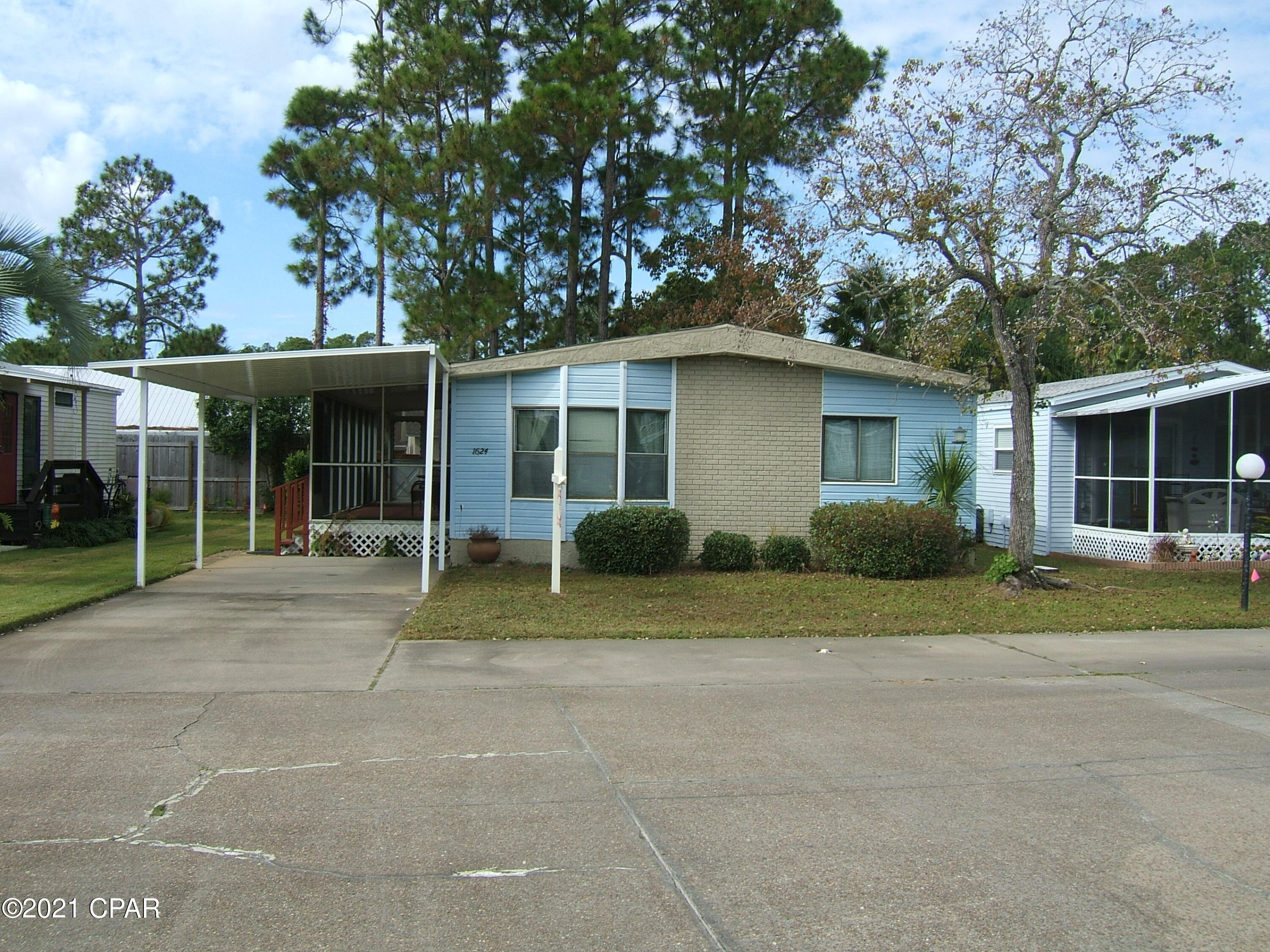 Back on the market due to buyer hours cut. Have home inspection all completed. This well kept manufactured home is very clean and updated. Split bedroom plan, new roof and neat as a pin. Large living room area and screened outside porch provide for outdoor activities without bugs! Furnishing are negotiable. Bring your boat, RV and swim suits to this 55+ retirement community. Your recreational toys are secure in a locked, fenced, well-lighted community lot for a small $20 monthly fee. Community pool and clubhouse available. Monthly rentals allowed. Home was rented for $1000 per month. Many owners in the community are winter residents, whose lawn care is still maintained 52 weeks a year. In addition to lawn care, the owners' association also pays for water, trash, and cable.