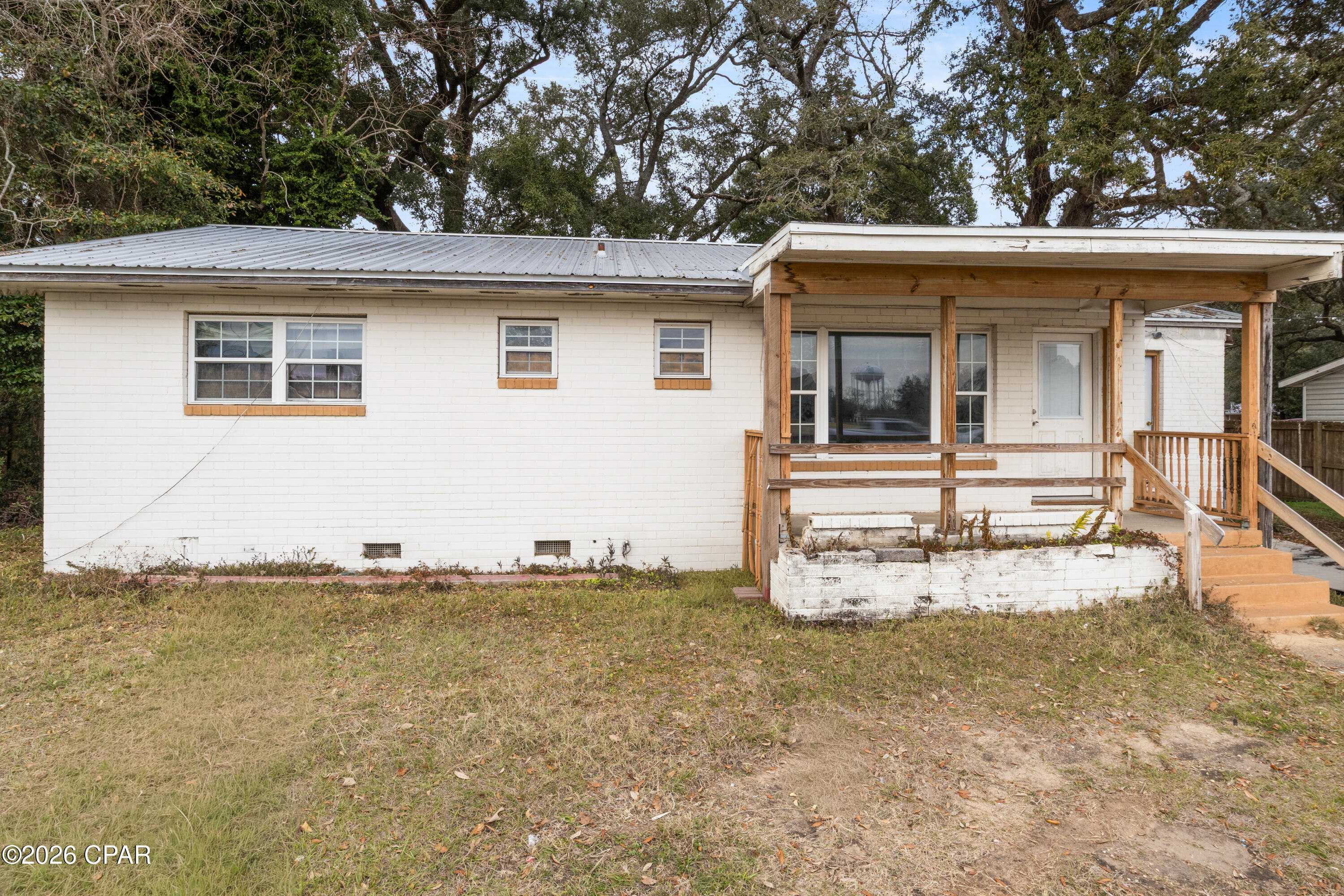 This 3-bedroom, 2-bath ranch home in Pensacola offers 1,420 square feet on a 0.24-acre lot with mixed-use zoning (HDMU), providing flexibility for residential or other permitted uses. Built in 1960, the property is positioned near I-110 for convenient access to major routes, with no HOA restrictions.



Inside, the home features a traditional single-story layout with defined living, dining, and kitchen areas. The floor plan includes three bedrooms and two full baths, supporting a range of living arrangements or workspace needs depending on use. Interior finishes reflect the home's age and may present opportunities for updates or customization.



Key systems include public water and sewer connections, along with standard electric service. The property is currently vacant, allowing for immediate access for inspections, improvements, or occupancy planning. Buyers should verify zoning allowances and intended use with local authorities.



The exterior includes a covered front porch and paved parking area, with a lot size that supports additional parking, storage, or outdoor use. The parcel's size and zoning may appeal to buyers looking for flexibility beyond standard residential use.



Located in Escambia County, this property offers proximity to Pensacola amenities, shopping, and commuter routes. Buyers are encouraged to conduct due diligence on zoning, condition, and any improvements to align with their intended use.