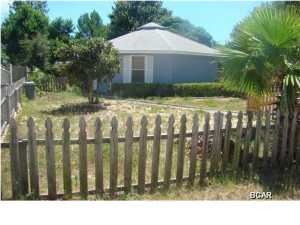 Nice home in a quiet neighborhood with a unique design. This home features open floor plan, ceramic tile throughout, cathedral ceilings, skylights, large screened porch, and fenced yard. Centrally located on the beach to schools and shopping. Key in office.