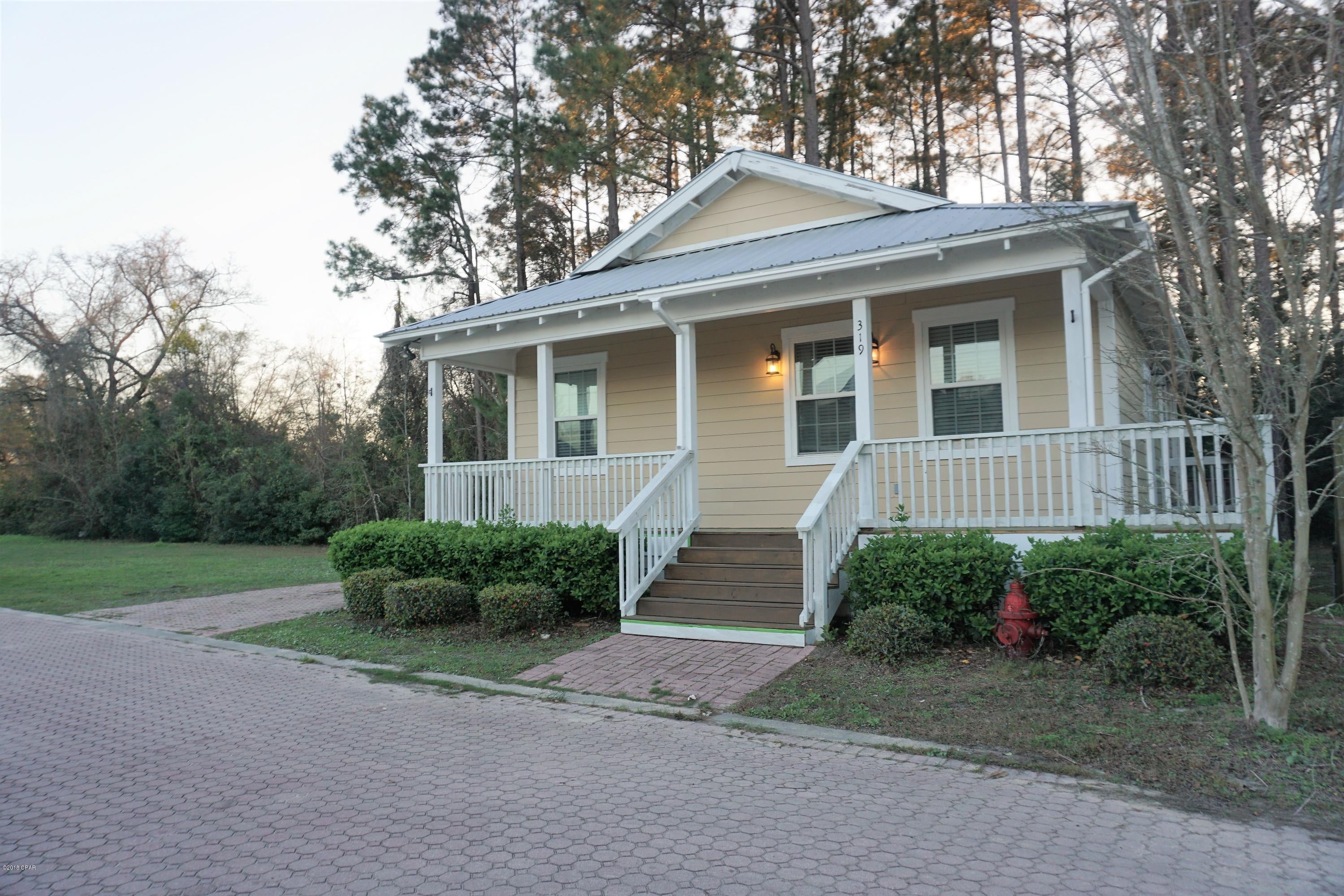Beautiful energy efficient home in Callaway Corners. Split bedroom floor plan with all brand new decking for wrap around porch and back patio.  Kitchen boasts with custom cabinets, granite counter tops, ceramic tile floors, stainless steel appliances. Nice large laundry room located off of the kitchen.  Master bedroom has updated double vanities with granite counter tops, large separate tiled shower, and large whirlpool soaking tub. All new light fixtures. Beautiful new deluxe laminate flooring throughout including bedrooms. Privacy fenced back yard. Metal roof. Neighborhood has paver streets and driveways and playground areas.  All measurements appx. Please verify if important
