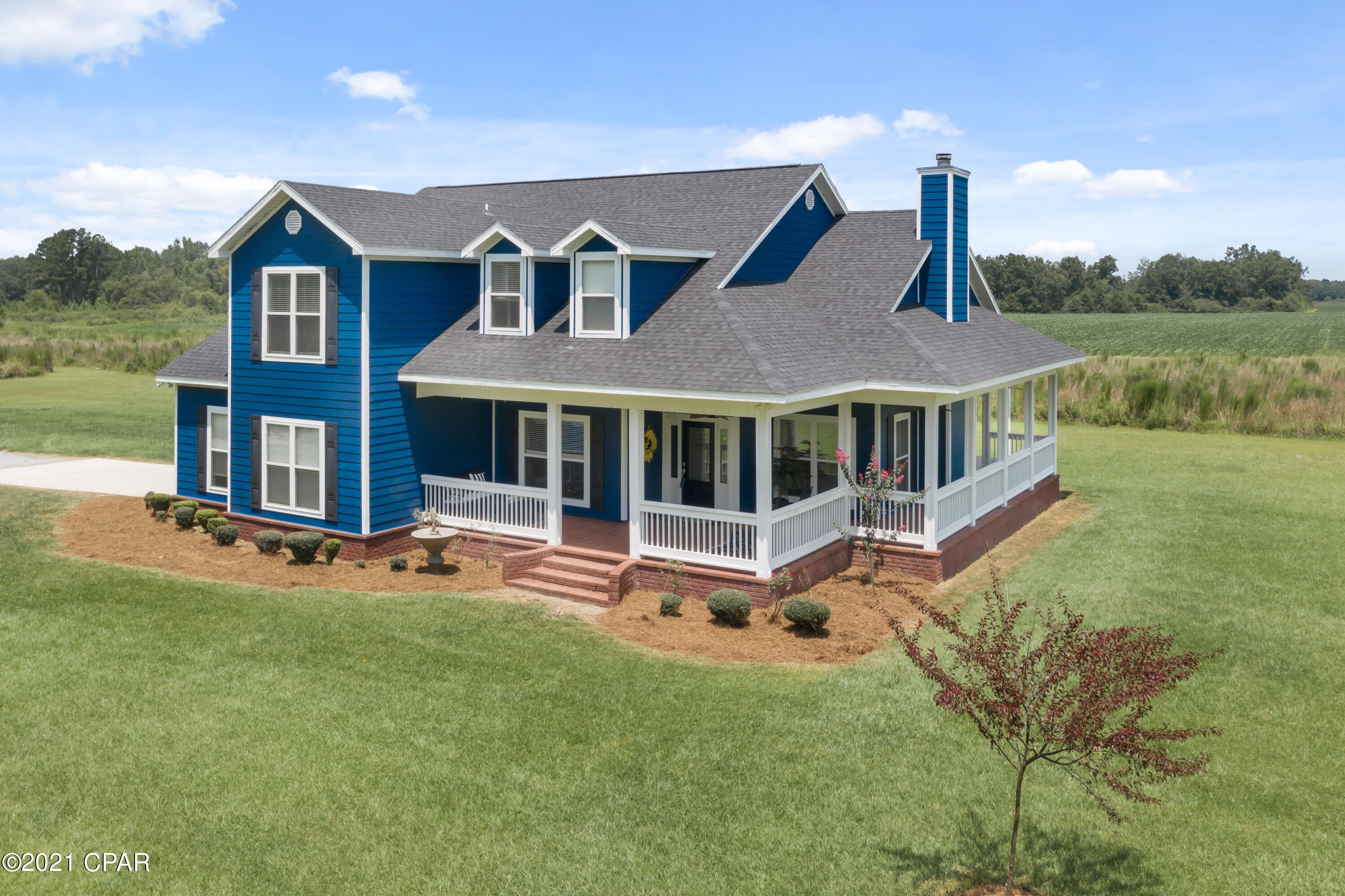 Looking for a beautiful custom-built home with all the gorgeous views and acreage? LOOK NO FURTHER! This 4-bedroom, 3.5 bath home sits on 8.43 +/- acres with amazing pasture views from the partial wrap around porch! Inside you are immediately greeted with gorgeous hardwood floors, a massive living room boasting cathedral ceilings and wood burning fireplace that is open to the spacious kitchen with custom cabinetry, granite countertops, raised breakfast bar and stainless-steel appliances. No expense was spared inside the master suite with large walk-in closet, his/her sinks, jetted tub and custom tiled shower. The formal dining room, laundry room and ½ bath complete the main level of the home. Your guest will feel a sense of privacy on the second floor that features 3 bedrooms, 2 full bath and bonus room. Outside you will find luscious landscaping, attached garage and circular drive. This home has so much to offer! This rare find is located close to tri-county airport and Hwy 77 at the Washington/Jackson county line.