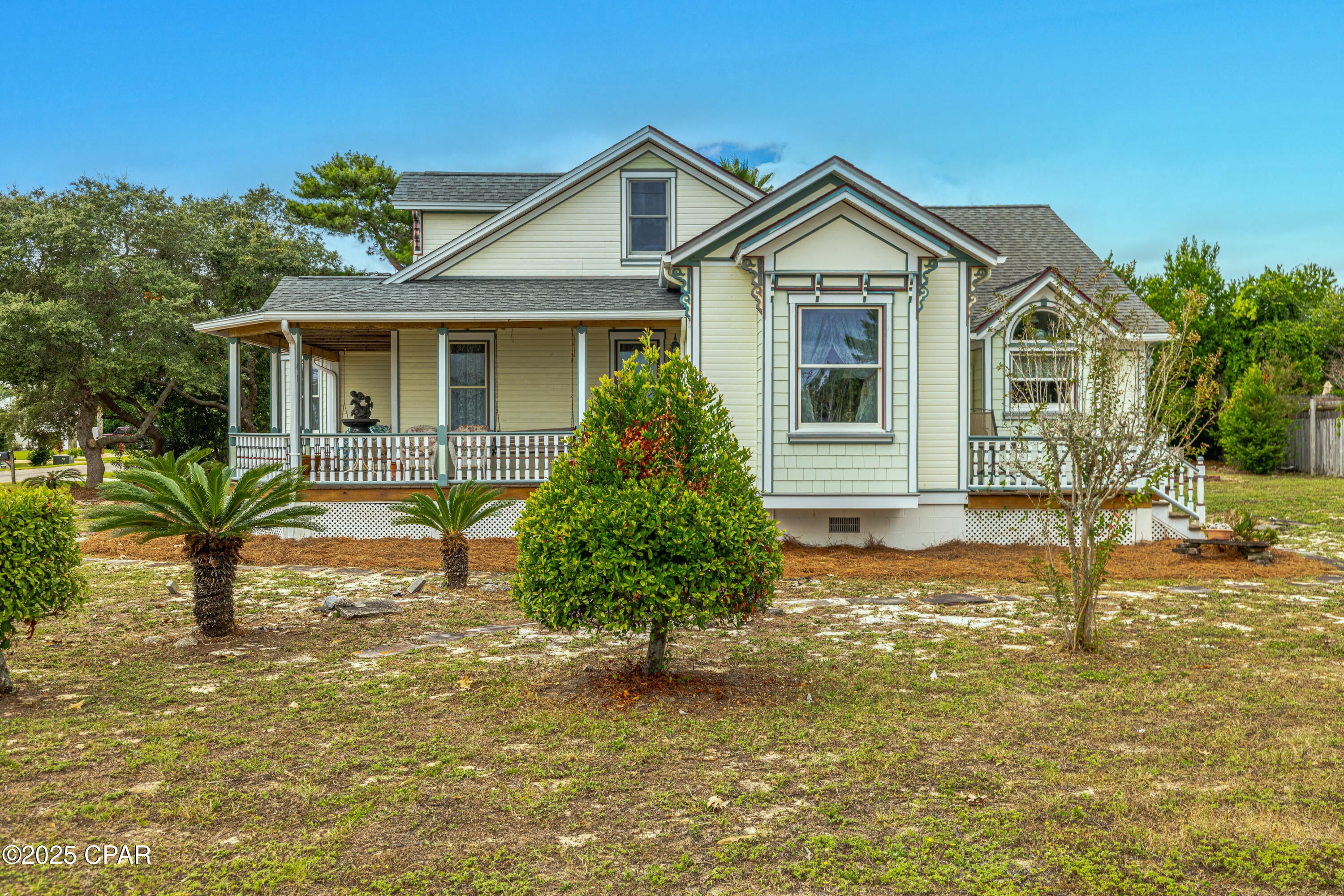 Charming Victorian at the Beach - 
Step into this unique Victorian-style home situated on a very large corner lot just blocks from the beach. With its classic wrap-around porch and timeless details, this home is filled with warmth, character, and plenty of space for making memories.
Inside, you will find 10-foot ceilings, solid wood doors, and bright, open rooms that feel both comfortable and inviting. The kitchen features custom cabinets and shelving, beautiful granite countertops, a Jenn Air downdraft range, and an extra gas cooktop--perfect for preparing meals to share with family and friends.
Upstairs, a 260sqft bonus room with half bath offers flexible space for guests, hobbies, or a cozy retreat. Everyday living is kept easy with thoughtful features like a geo-thermal heating and cooling system, an 1100sqft, 3-car garage with workshop, and a laundry area with shower - a welcome convenience after beach days. The home's living space can also be expanded into the garage, offering you endless options for the future.
Step outside to enjoy a 316 sq. ft. wrap-around porch and a 144 sq. ft. deck, perfect for morning coffee, breezes, and sunset gatherings.
This is also a prime investment / short-term rental location. Blocks from the beach and just 10 minutes from Pier Park with its endless shopping, dining, and entertainment, and only 5 minutes to scenic 30A and South Walton's upscale dining, boutique shopping, and nightlife, you'll be at the center of everything the coast has to offer.