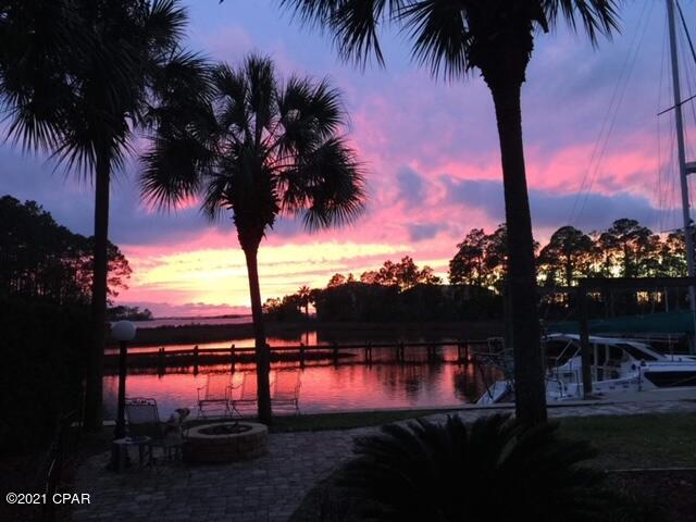 Immaculately kept waterfront, pool home with boat slip and tidal access to the bay. This contemporary 4 bedroom 3 full bath home is one you will want to call your own.   Home features a master on the main floor, an updated kitchen, eating area, and living room with unbelievable views of the waterfront, sunsets, and marine life.  Main floor also offers a separate front office, large laundry room, guest bedroom, and full second bath.  The upstairs is like new with new carpet, sheetrock, and paint and has barely been used since recently renovated.  Upstairs features 2 bedrooms with water views, and boasts a  third full bathroom.  Enjoy those gorgeous sunsets with family and friends from your enclosed pool and hot tub.  Home is beautifully landscaped with pavers, and a fire pit at the water. Additional features include  kitchen island with Jennaire convection down draft cooktop, a cozy, double see through fireplace  (gas and/or wood burning) to enjoy from the kitchen eating area and the living room, under counter wine cooler, two heat pumps, two water heaters, plenty of storage, and a separate irrigation meter.  Two outside storage sheds and semi circular driveway.  New roof in 2019 and newer windows and newer seawall and boat slip.  All appliances and pool equipment convey with sale. 

This home is a beauty you will not want to leave!!!

Curtains in the Living Room, Master Bedroom, and Guest Room upstairs (with bed) does not convey.  Also, outside potted plants and wind chimes do not convey. 

All information is reliable but not guaranteed.