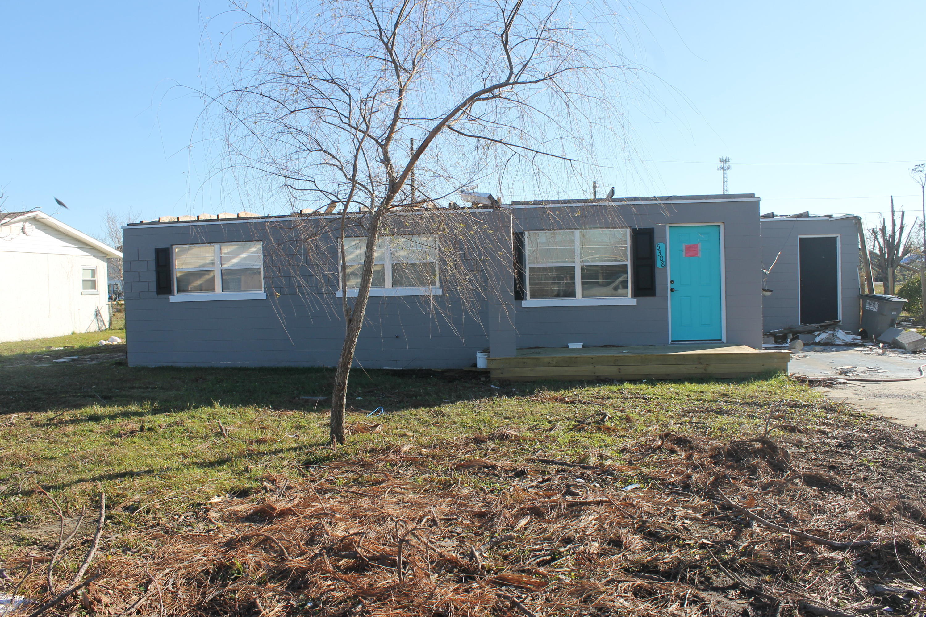 Was Once  A Super cute Florida cottage. Severly damaged from Hurrican Michael... Can be renovated or tore down and re build. Home is a block home. Was Renovated inside from top to bottom. New fixtures, interior doors, floors and new paint. There is a beautiful backsplash in the brand new kitchen. Open floor plan that feels cozy and warm. The love for this houses shows in all the upgrades the owners have done.   You can access this home from the front or back; the garage (workshop opens to Harvey). The garage,36x24, has water and electric, and fish sink. House has a water softening system and 2 water meters, 1 supplies the garage.  Close to Tyndall AFB and shopping!