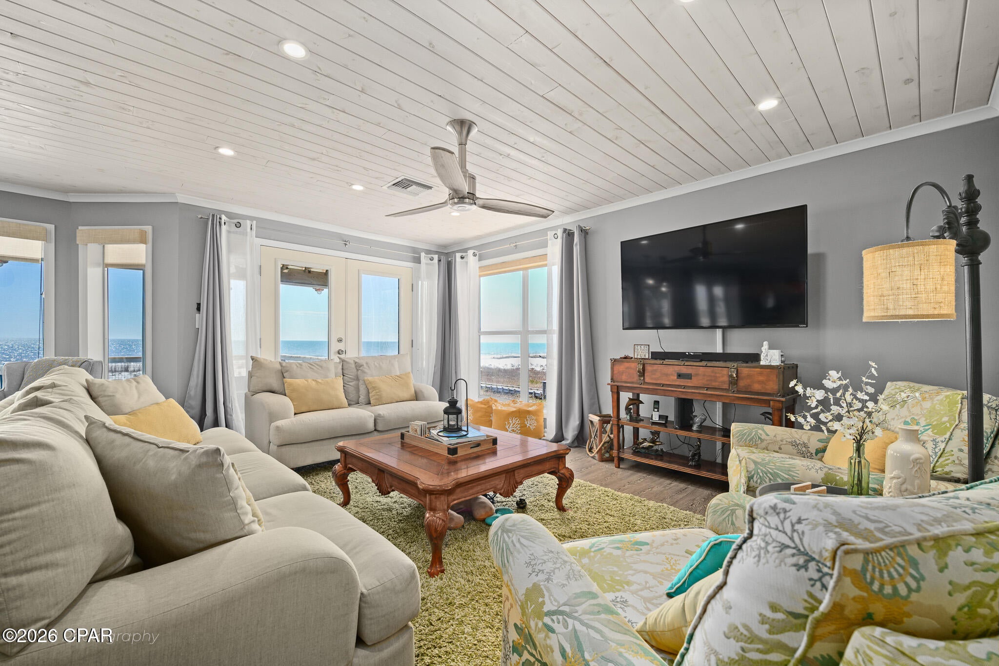 UNDER CONTRACT. SELLER IS ACCEPTING BACKUP OFFERS. Set on the sand along CR 30A, 6986 CR 30A in Port St. Joe delivers the direct beachfront feeling: salt air, open water, and a horizon that becomes your backdrop all day and night. Even better, this home's flood policy is assumable at a very attractive premium! Inside, the remodeled interior features solid surface countertops, tongue-and-groove ceilings, and upgraded lighting for a bright coastal vibe. Two large bedroom suites, both of which face the Gulf to maximize views, also feature their own private living areas. Step outside to the updated balcony and decking with both screened and open air spaces for coffee at sunrise, shade in the afternoon, and sunset color over the Gulf. Sold fully furnished and not used as a rental, the home shows pride of ownership and is ready to enjoy right away. The shoreline here is known for calm, walkable beach days through the seasons, plus dog-friendly beaches for morning and evening strolls with sunrise and sunset views just steps from your door. Minutes to Money Bayou and the Indian Pass boat launch for boating, fishing, and exploring the coast, and a short drive to Cape San Blas amenities and the State Park, as well as downtown historic Port St. Joe for shopping and dining in style. AE flood zone. No HOA. See the 3D tour for an easy virtual showing! Contact for more details and private showing.