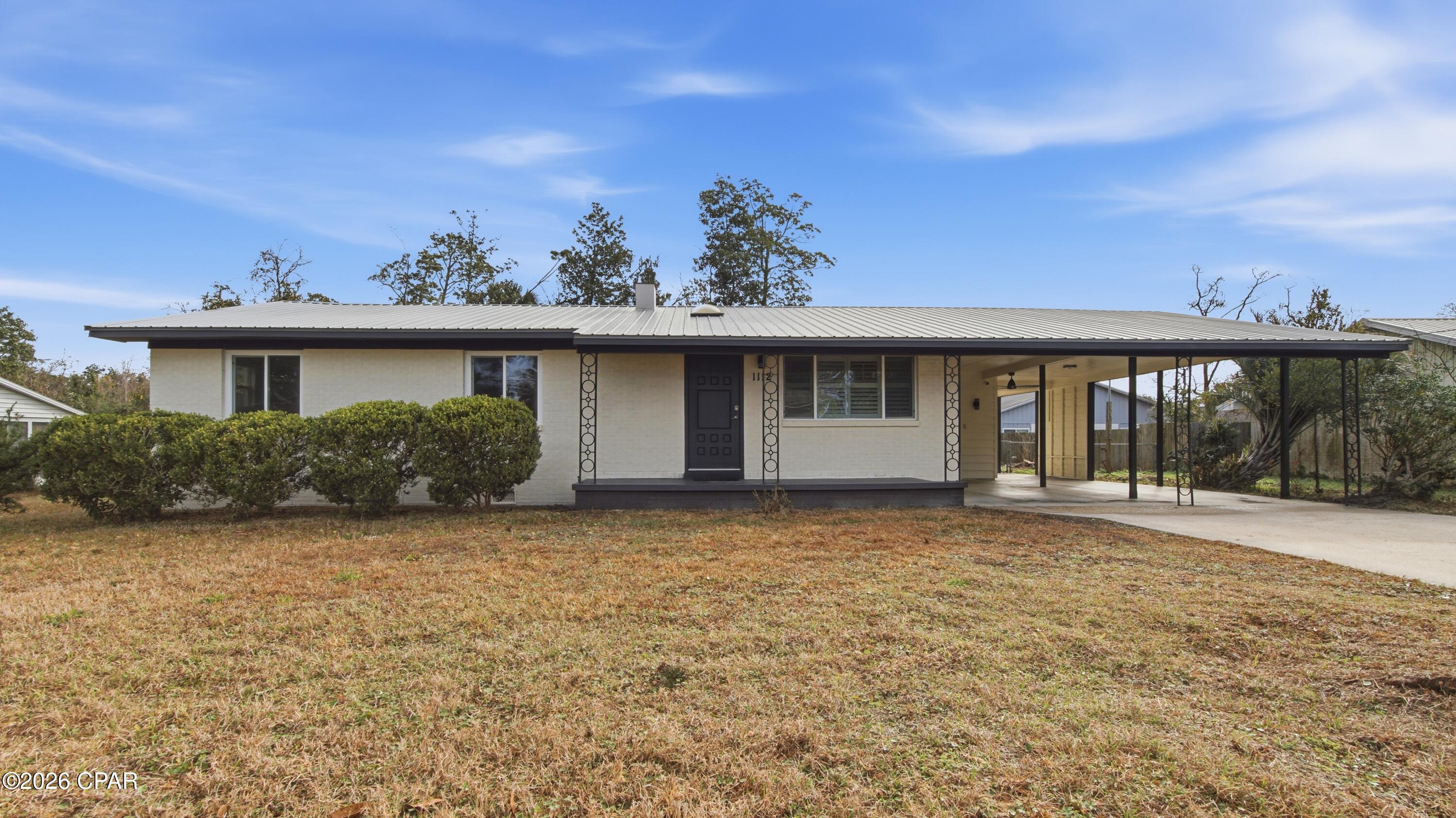 This centrally located brick home is move-in ready and waiting for its new owner. Situated on approximately a quarter acre, the property offers impressive parking accommodations with space for up to 6 vehicles, including a 2-car covered carport and a large driveway. The spacious yard provides plenty of room for outdoor enjoyment, entertaining, or simply relaxing at home.
Inside, you'll find an open floor plan with durable wood laminate flooring, upgraded lighting, and numerous recent updates for peace of mind. The home features a metal roof installed in 2018, a new 40-gallon water heater, fresh interior and exterior paint, plus all windows and exterior doors replaced within the last five years. The kitchen is both functional and stylish with granite countertops, abundant cabinet space, and all appliances conveying with the sale--including the washer, dryer, refrigerator, dishwasher, range and microwave. The primary bathroom showcases a beautifully tiled walk-in shower, adding a modern touch to the space. Step outside to enjoy the spacious back deck, perfect for relaxing evenings or hosting family and friends. Ideally located just minutes from Downtown St. Andrews and Downtown Panama City, this home offers unbeatable convenience to shopping, dining, entertainment, and local events. Whether you're searching for a primary residence or a solid investment opportunity, this property provides exceptional potential, value, and convenience.
Please verify all information and measurements for accuracy.