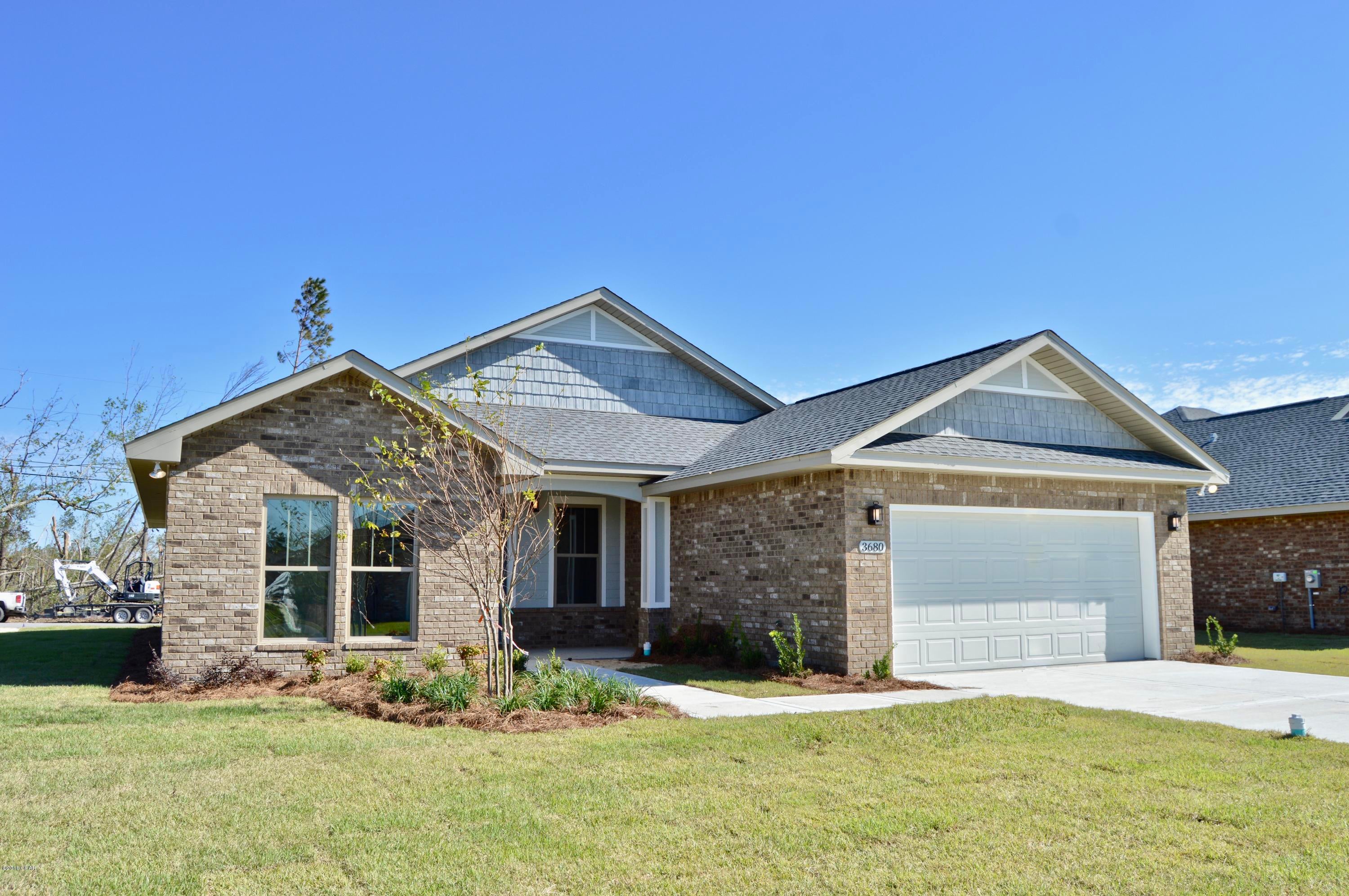 NEW CONSTRUCTION-CEDAR PARK PC-4/2-Offering easy access to greater Panama City, Panama City Beach and TAFB! All brick home offers Great Room with 9 ft raised tray ceiling, dining room, kitchen with island, granite counters and stainless appliances, master suite with tray ceiling, double vanity, separate shower, walk-in closet. Other interior features include tile flooring, recessed lighting, custom cabinetry, distinctive lighting fixtures and upgraded ceiling fans. Exterior includes brick siding, 2 car garage, covered porch, landscaped and sprinkler system. Cedar Park features landscaped entrance, natural park, pavilion, underground utilities, custom street lighting and sidewalks. All listing info should be verified. All materials and finishes are subject to change