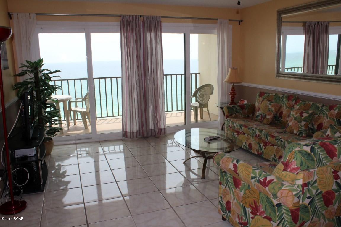 This condo may be toured today! Enjoy relaxing on the oversized balcony and watch the ships as they come through the pass.  This two bedroom Commodore unit is located on the quiet east end of the beach within walking distance to St. Andrews Park.  Fun times at the Commodore while you spend time in the gulf front swimming pool, hot tub, grilling steaks in the covered picnic area and then challenge your friends to a game of shuffle board or basketball.  Don't forget you also have 24 hour security at this complex.  This unit has recent upgrades of new high wind impact sliding doors and tile.  Established rental record makes this as a great investment property.  All information  is contained herein is intended to be correct however buyer assumes responsibility for verification of all information.