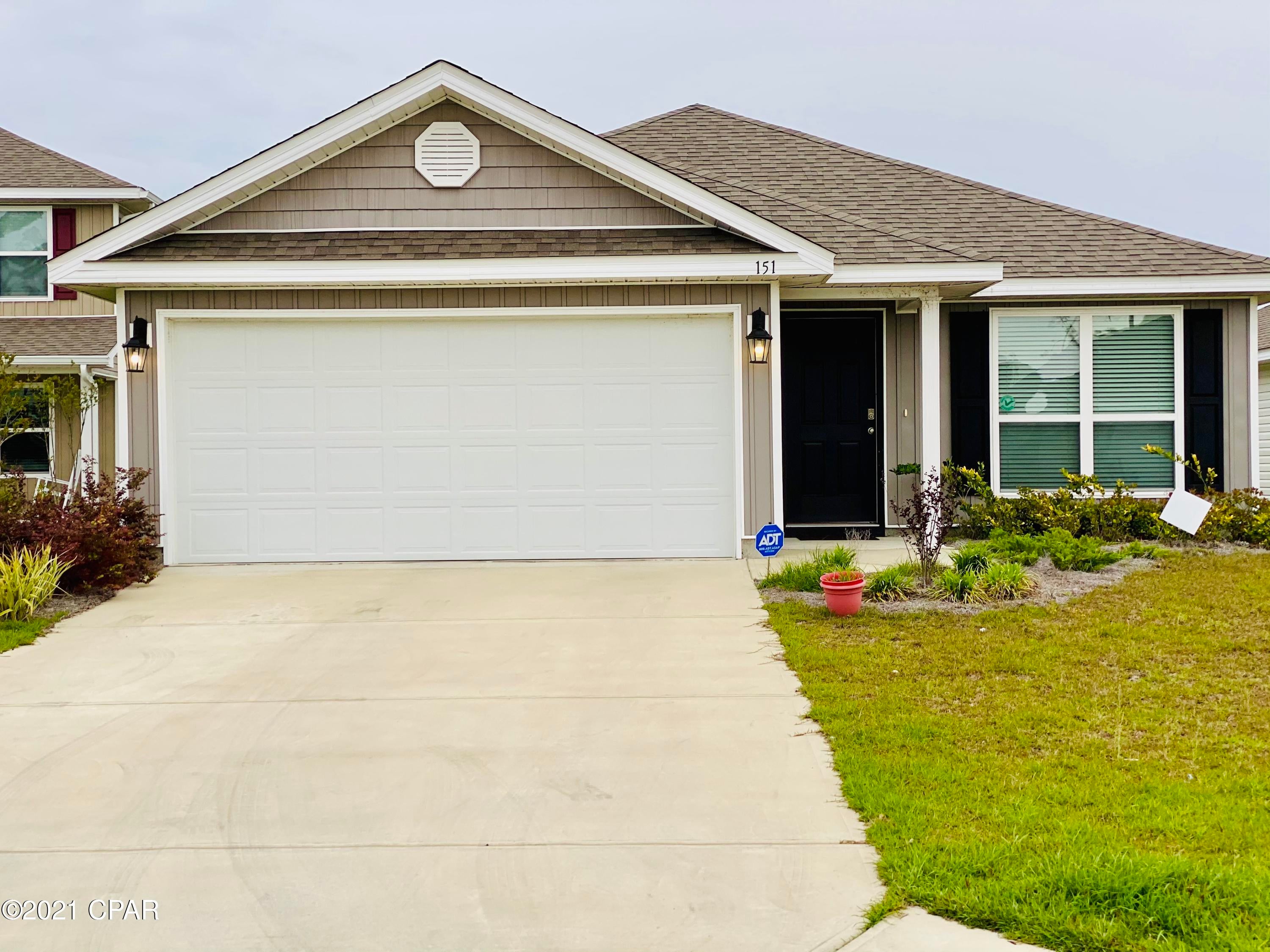This 4 bedroom 2 bath house is an excellent choice for anyone wanting to live in a planned unit development. As you enter the foyer the traditional 8' ceilings, decorative doors with brushed nickel hardware and vinyl sheet flooring throughout the common and wet areas of the home make for easy upkeep. The first bedroom is at the front of the home and looks out to the landscaped front yard. The kitchen is open and has plenty of cabinetry and pantry for lots of storage. The stove, microwave, refrigerator and dishwasher convey. The small hallway just off the breakfast area leads to 2 bedrooms, hall bath, laundry area and out to garage, keeping the master suite separate and more private. The back yard looks out onto the lovely pond where many a cookout and socializing is most convenient. Enjoy a resort style community pool, spa, gas grills & playground! Only 22 miles to Tyndall Air Base and 16 miles to airport!