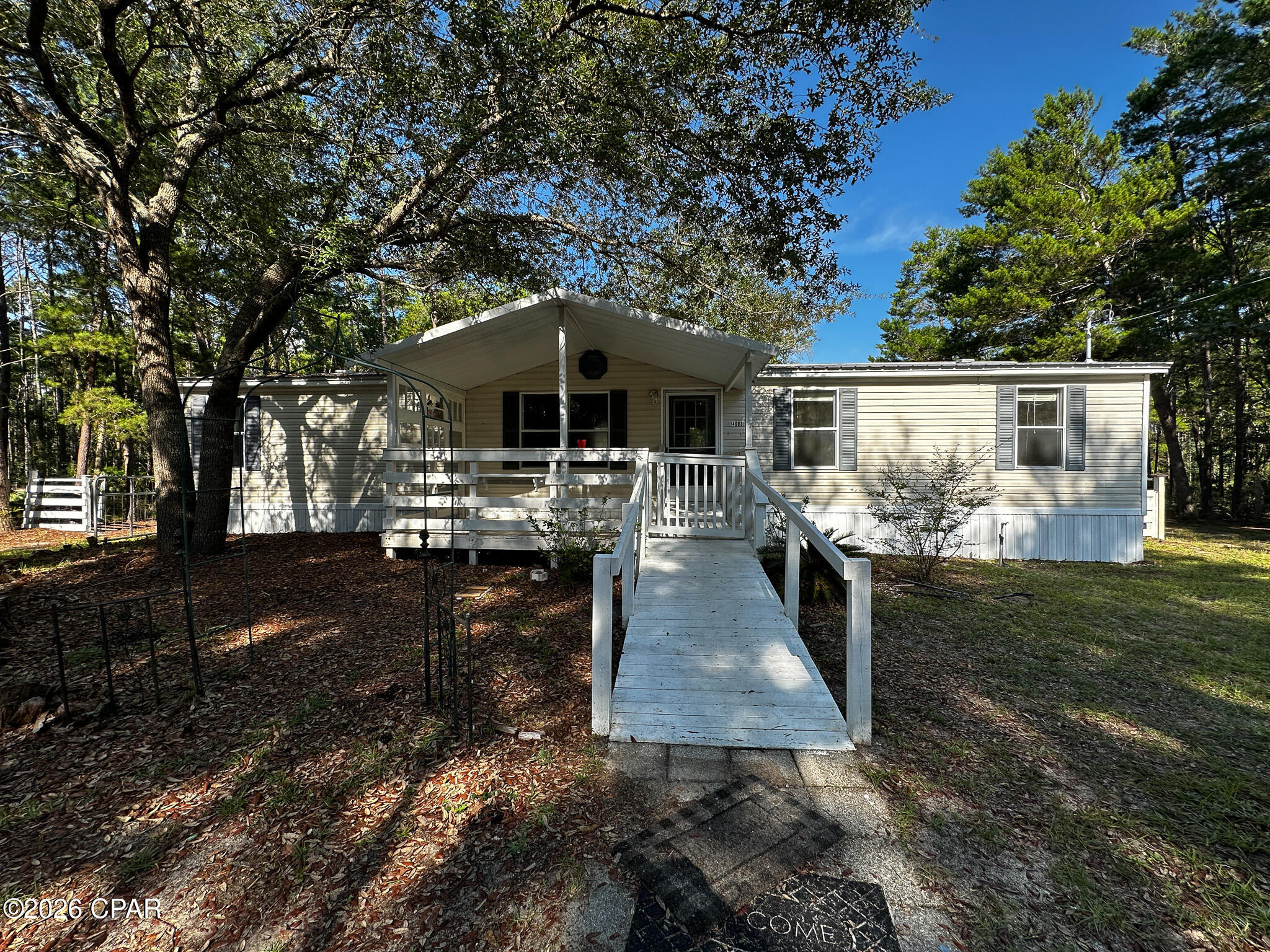 Welcome to your own private retreat! Nestled on approximately one acre at the end of a long driveway, this property offers privacy and a peaceful setting surrounded by mature trees in both the front and back yard.

The home features covered front and back porches, providing the perfect space to relax and enjoy the outdoors. A carport with an attached storage shed offers additional parking and plenty of room for tools, equipment, or hobbies.

Numerous recent updates make this home move-in ready, including a new HVAC system, new well, new PEX plumbing, new water heater, new range, and new dishwasher. A few of the rooms have also been freshly painted and exterior pressure washed for added curb appeal.

Bonus: Qualified buyers may have the opportunity to assume the existing VA loan with an outstanding balance requiring approximately $70,000 down and an attractive 2.75% interest rate--a rare financing opportunity in today's market.

If you're looking for quiet country living with updates, a metal roof and room to spread out, this property is a must-see. Conveniently located while offering the privacy you've been searching for, it's ready for its new owners. Schedule your private showing today!