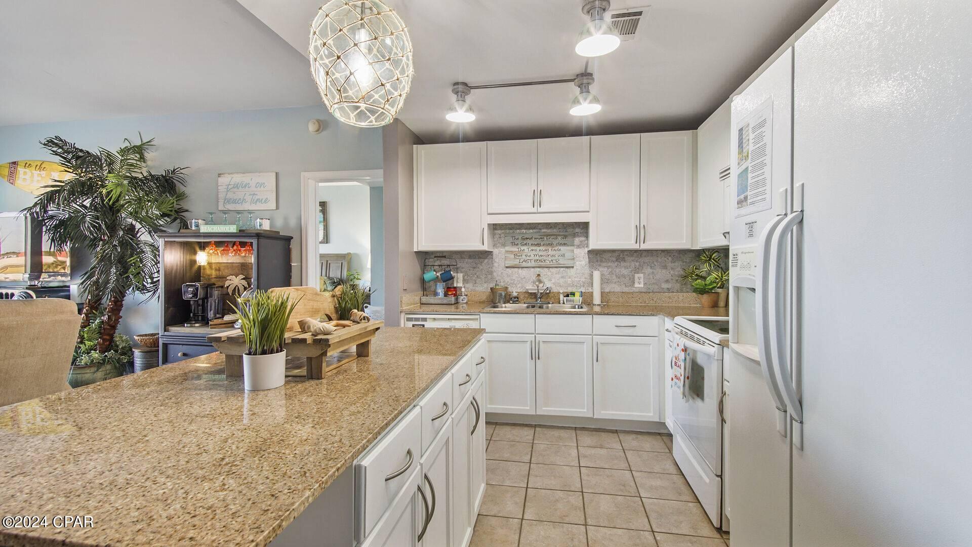 Priced to SELL!  Awesome low floor,  2 Bedroom, 2-Bath with Private Bunk Room Condo for sale at Laketown Wharf in Panama City Beach, FL!  Want a FUN and creatively decorated Condo at the Beach??  Then this is for you!! This Condo has been designed to be the most fun Vacation home ever! Tastefully REMODELED condo is uniquely designed, featuring a bunk room that adds an extra touch of versatility and comfort which converts from a twin to a king size bed. The bunk room has barn doors creating privacy! The living area adds a touch of the Beach Jeep flair! There are several  entertainment options providing a fun and lively atmosphere.
Several restaurants are situated below, live music, coffee, tacos, pizza, ice cream, and the iconic Pineapple Willy's is across the street, offering a variety of dining options.
GAMES!!  A full-size arcade with over 10,000+ video games loaded (from Atari to PlayStation and all arcade classics), a baseball bean bag toss, Hook 21, Connect 4, plinko-pinball and Tic Tac Toe.  Condo is equipped with a record player with Bluetooth feature for those that enjoy listening to their favorite tunes while relaxing.  The balcony offers unique Barrel seating for relaxation, dining table for four and a relaxing double person hammock. Master Bedroom faces the water with sliding glass doors, allowing for an Extra large Balcony!  The Main bedroom has a king size bed, with USB outlets on both nightstands, Roku TV with cable, extra sleeping with an ottoman that folds out to a twin-size mattress bed, and dresser.  The Huge Ensuite Bathroom has double sinks, garden tub, walk-in shower with an updated rain head.  The Living Room is uniquely designed with a Jeep Crate side table and coffee table, sleeper sofa, rocking recliners, and a Roku TV.  Ninja Dual Brew Coffee Maker (pods or a pot of coffee), and a Margaritaville Machine!
Laketown Wharf has impressive amenities, including four swimming pools to meet everyone's style, pickleball courts, BBQ grills for outdoor cooking, and a putting green for golf enthusiasts. Fitness enthusiasts will appreciate the presence of a huge fitness center that is fully equipped! A large boardwalk provides a scenic spot to eat, sit, and enjoy the serene lake views and nightly dancing water fountains!  This is a Rental machine that guests will want to rent again and again!  The Sellers have a website that can be transferred over to the new owner.