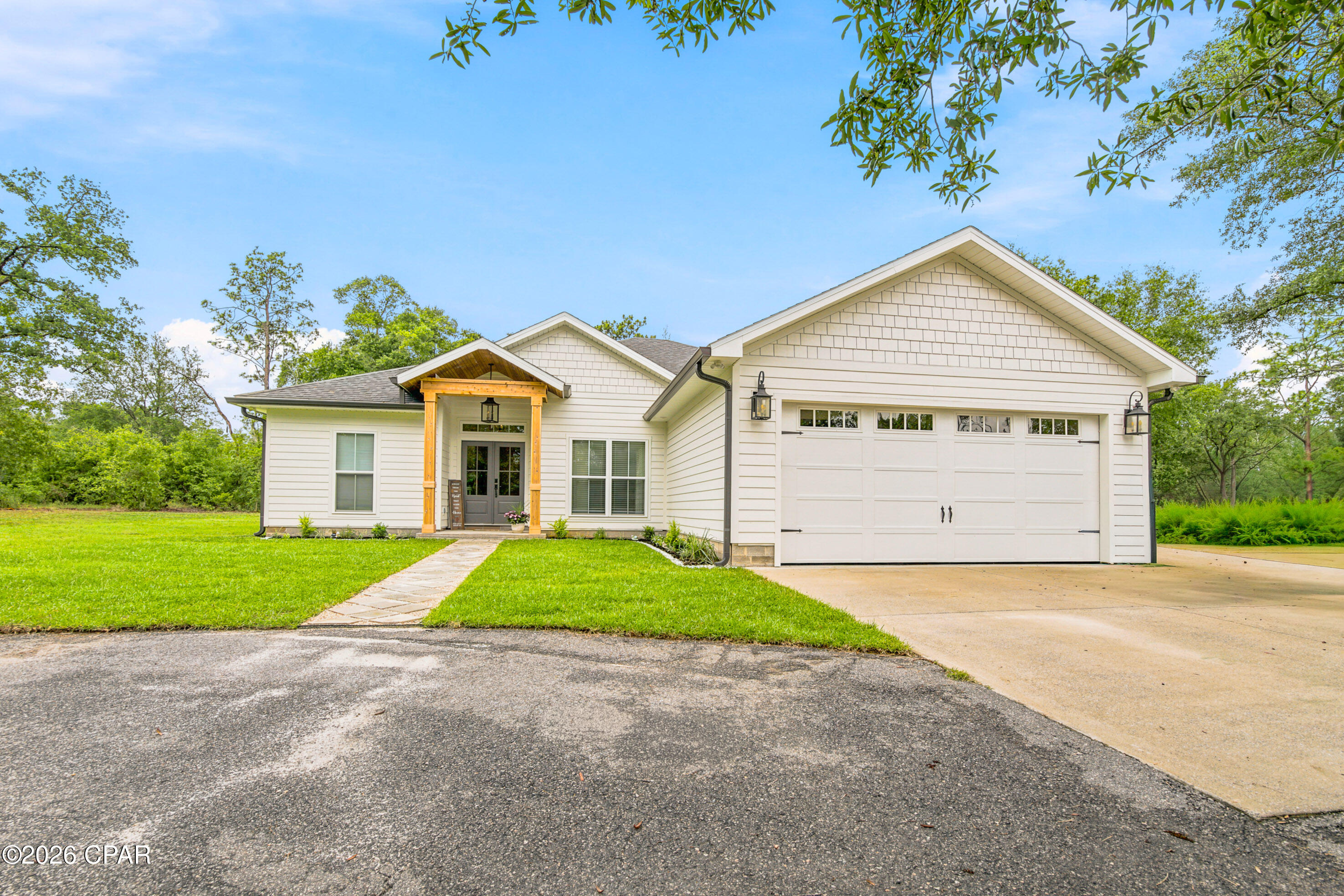 OPEN HOUSE!! July 25th & 26th from 1pm to 4pm. 

Looking for peaceful country living with the security and amenities of a gated community? This stunning Craftsman-style home, situated on nearly 3 private acres, offers the perfect blend of comfort, privacy, and convenience.

Enjoy community amenities including beautiful lakes for fishing and swimming, a basketball court, tennis court, pavilion, grilling area, boat launch, and a playground all surrounded by natural landscapes, perfect for quality time with your favorite people.

Pride of ownership shines throughout this meticulously maintained home, lovingly cared for by its original owners. As you arrive, you'll be welcomed by a freshly landscaped circular driveway that creates an inviting first impression.

Step inside to discover a spacious split-floor plan with an open-concept design, offering the perfect balance of privacy and gathering space. The owner's suite is a true retreat featuring a luxurious ensuite bathroom with a soaking tub, separate shower, dual vanities with granite countertops, ample storage, and a large walk-in closet.

A versatile front bedroom currently serves as an office/playroom, while two additional spacious bedrooms and a conveniently located full bath provide plenty of room for family and guests.

The heart of the home is the beautifully appointed kitchen, complete with custom cabinetry, granite countertops, and abundant workspace--ideal for the home chef or creating memorable family meals.

Start your mornings with coffee or unwind in the evenings with a glass of wine on the covered back porch overlooking mature oak trees and the natural beauty of your private backyard sanctuary.

🌿 Privacy, beauty, and community amenities all in one exceptional property!