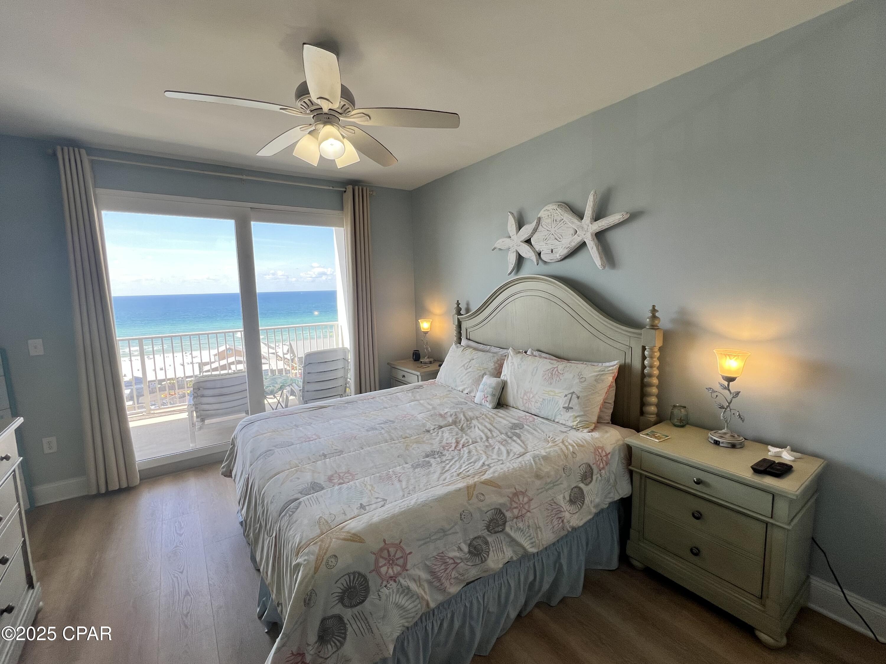 Enjoy the amazing Gulf Views from the 10th floor of Laketown Wharf Resort. With private access gate to the beach and 5 pools, pickleball, bars, pizza, seafood, taco, Ice cream and more available, you always feel like there is something fun to do at this resort.
This unit is a spacious 2 Bedroom, +Bunkroom, 2 Full Baths, being sold completely furnished, includes all major kitchen and laundry appliances and patio furniture. Enjoy the 28'x8' covered balcony on those sunny afternoons and coffee in the morning looking for dolphins swimming by!  This complex is located on S. Thomas Drive across the street from Pineapple Willy's Restaurant.
COA dues include INSURANCE, Cable, Internet, Water, Garbage and use of parking garage and property amenities like FULL 2 STORY GYM, Pickleball, Mailroom and is secured by Property Patrol 24/7. This unit is ready for SHORT TERM RENTALS. Gulf views from the front of the condo and peaceful Lake & Boardwalk views from the covered balcony.