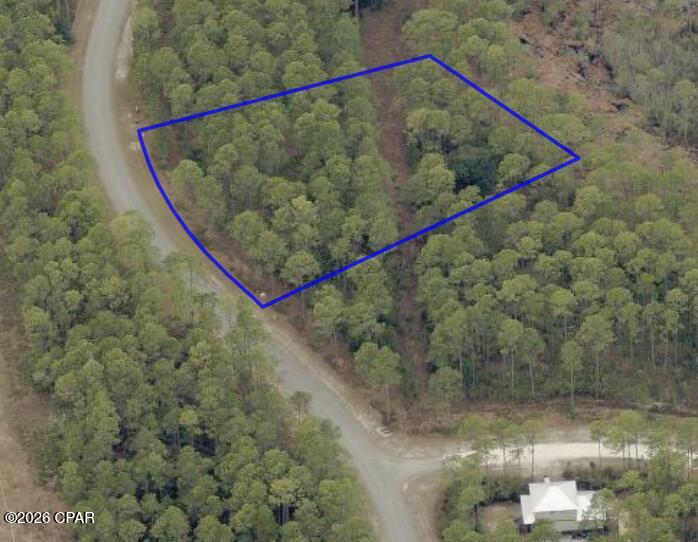 Fantastic 1 acre Lot, large buildable area with minimum setbacks allowing you to build the home you want. Whether you have your own builder and plan or would like to work with the listing agent finding a designer and builder, this Lot is priced right at $110,000. Paved road, no neighbors behind or across the street. RiverCamps is the only gated community in Panama City Beach that can offer large, acre plus Lots at these prices. RiverCamps is a gated, waterfront community surrounded by Crooked Creek, Intracoastal waterway and West Bay. 1500 acres, less than 450 homesites and 1000 acres committed to conservation. There are over 7 miles of trails and connected boardwalks for walking, biking or exploring by golf cart. Owners enjoy a community boat ramp with direct access to West Bay and a 30-minute boat ride to the Gulf. Dry boat storage, wash basins, day use boat slips. Unlimited use of kayaks, canoes and paddle boards. 2 pickleball courts, a basketball court. Zero entry pool, screened pavilion and the new fitness center is nearing completion. Just outside the gates of RiverCamps you will find the NW Florida Beaches International Airport (10 minutes away), 2 miles from Publix grocery which is expected to be completed by March 2027, plus the announced 450,000 sq ft of adjacent retail space. New 180 bed hospital and medical campus less than 10 minutes away and the famous, white sandy beaches 10 miles away. RiverCamps is truly close to everything yet far from the traffic and crowds.