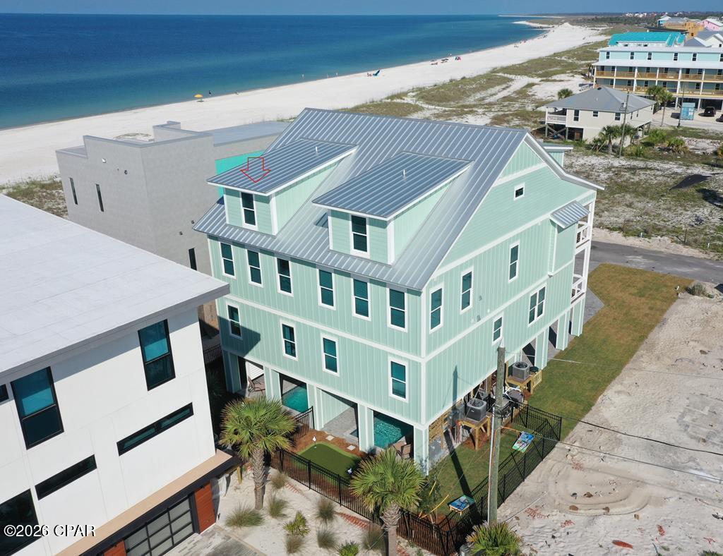 Established Rental Income! Just Stunning!! Fully Furnished and Rental Ready with 6BR/6.5B and 3,376 SF heated and cooled space. Unit B - That describes this luxury home built in 2023 and decorated to the nines. Located just one lot from the beach in Mexico Beach, FL and on the Beachside of Hwy 98. LEVEL 1 - Foyer and half bath. LEVEL 2 - Spacious Living-Dining-Kitchen with Designer Furniture, granite countertops, stainless appliances, backsplash, wood cabinets, farm sink and one bedroom with en-suite bath. Also powder room and laundry on this floor. This floor has a covered porch with views of the beach and sunsets. LEVEL 3 - 3 bedrooms with en-suite baths. The covered porch offers a private space to catch a breeze from the Gulf. LEVEL 4 - Family recreational area (geared for the kids) and 2 additional bedrooms with one hosting 3 sets of bunk beds. Multiple laundry areas. Luxury amenities including a private heated cocktail pool, putting green, recreational area and covered patio space. This property has endless possibilities whether being a home, vacation home, investment property OR family retreat. Enjoy the miles of beach to explore and a magnificent sunset every evening. Restaurants and shops nearby.