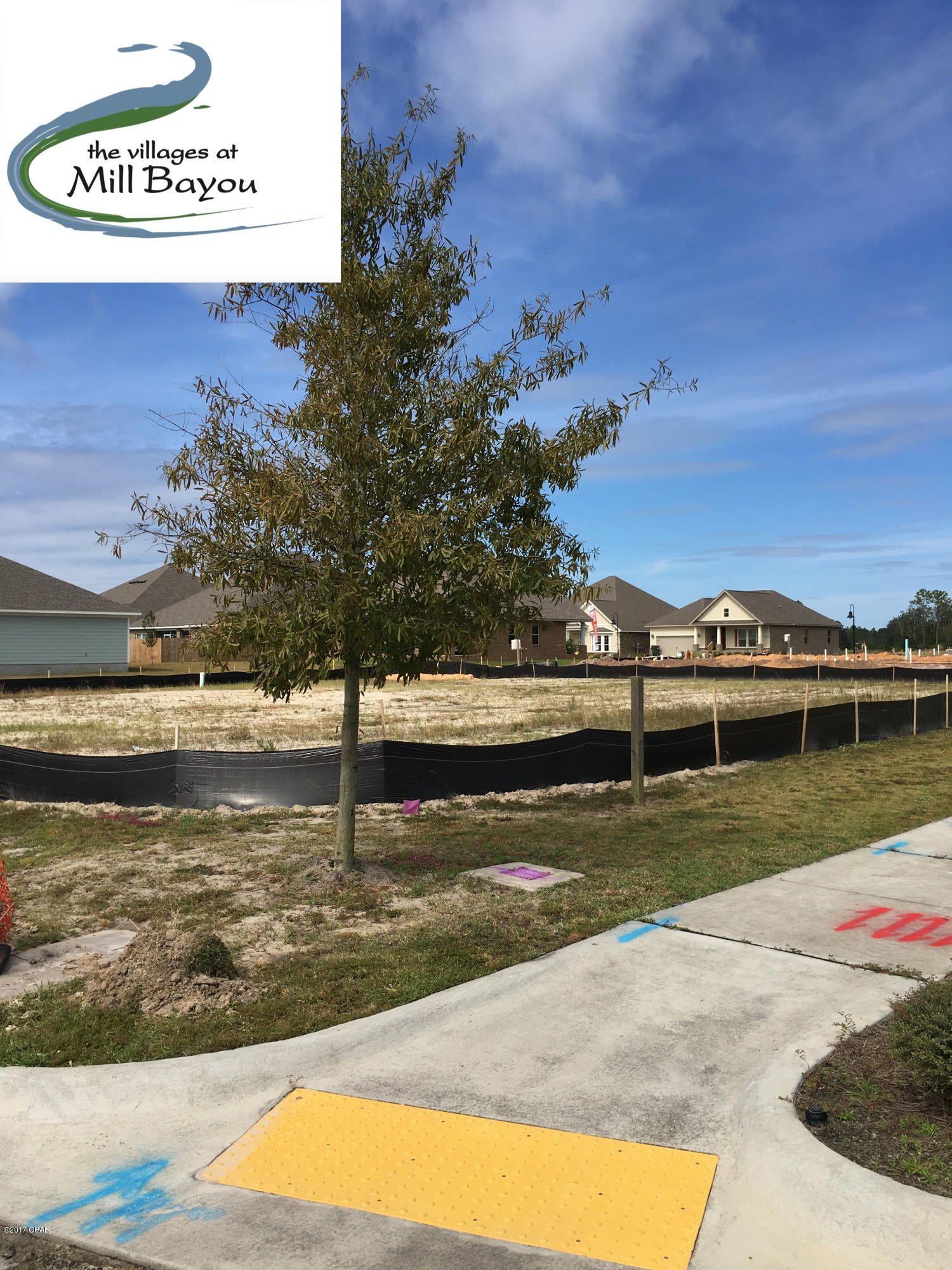 This is a rear loaded lot that will have a fron porch facing Mill Bayou Blvd and garage off of Blue Heron Lane and on street parking in front of the home on Mill Bayou also. Neighborhood has pool, firepit, sidewalks, street lights, wide streets for on street parking, 2 dedicated parks, conservation land, and ponds throughout. The development contains Deerpoint elementary on the north and North Bay Haven Charter Academy within walking distance on the south. Lot has potable water, reuse for low cost lawn and landscape irrigation, power, sewer, and natural gas.