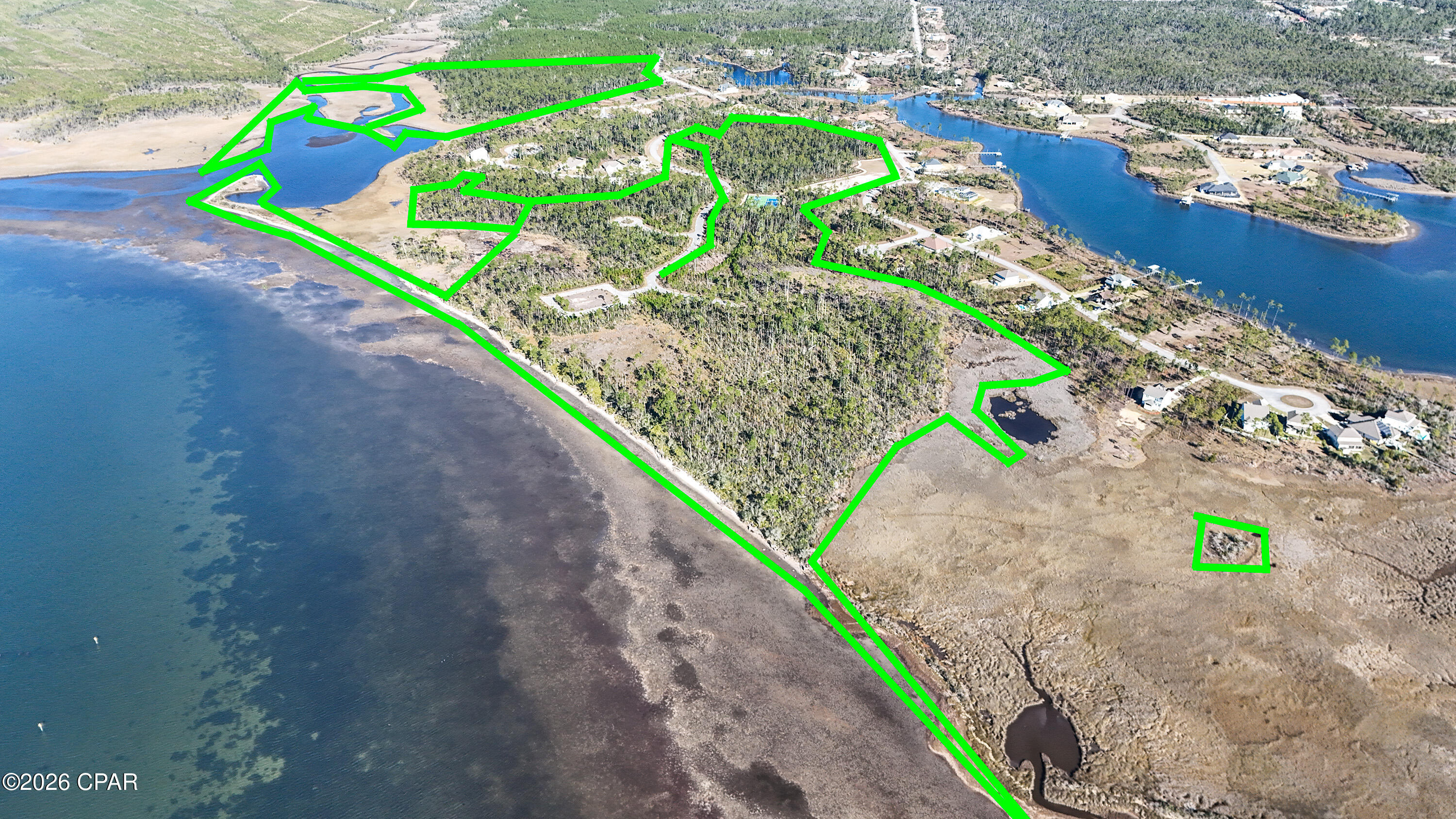 Welcome to Phase Two of Laird Point, a rare 90± acre waterfront development opportunity in Panama City, FL. This gated community includes 38 platted lots with paved roads and city water and sewer already in place, headlined by substantial undeveloped acreage with Conceptual Site Plans illustrating future development potential of up to 148 total lots, including 30 waterfront lots. The roads, dedicated common areas and amenities also convey with the sale, giving the new developer a blank canvas to add a pool, clubhouse, pier, walking trails and more. There is currently an active HOA for Phase 1 and the HOA for Phase 2 is inactive. Laird Point offers glowing waterfront sunsets, mature pine trees, and an abundance of natural beauty making a serene and private sanctuary. All lot lines shown in pictures are approximate and for demonstration purposes only. All future development illustrations in the pictures are for example purposes only and are not guaranteed to be allowable. Buyers to confirm all information, especially any allowable docks in any location in Phase 2. Don't miss this once in a lifetime opportunity and come see the property today!