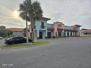 The structure is a Class A, Retail/Office, 6,901 square feet building with tremendous upside. It is constructed of concrete poured block and steel beam supported ceilings. The roof is tile and one-piece member of rubber. It is equipped with a complete fire sprinkler system and is monitored on a 24/7 basis. The complex also has ample parking and excellent signage on Thomas Drive. The building consists of 2 units with one at 4985 square feet and the other at 1916 square feet. Taylor's Restaurant (previously Egg & I Restaurant) currently occupies the 4985 square feet unit.  They are currently in their 3rd 5-year lease term.  Realty One Group of the Emerald Coast occupies the remaining 1916 square feet of the building.  They have a month to month lease. They have occupied the space for over 4 years. OWNER FINANCING AVAILABLE WITH 20% DOWN, 6% INTEREST, PAYMENTS BASED ON 30 YEAR TERM WITH A 10 YEAR CALL.