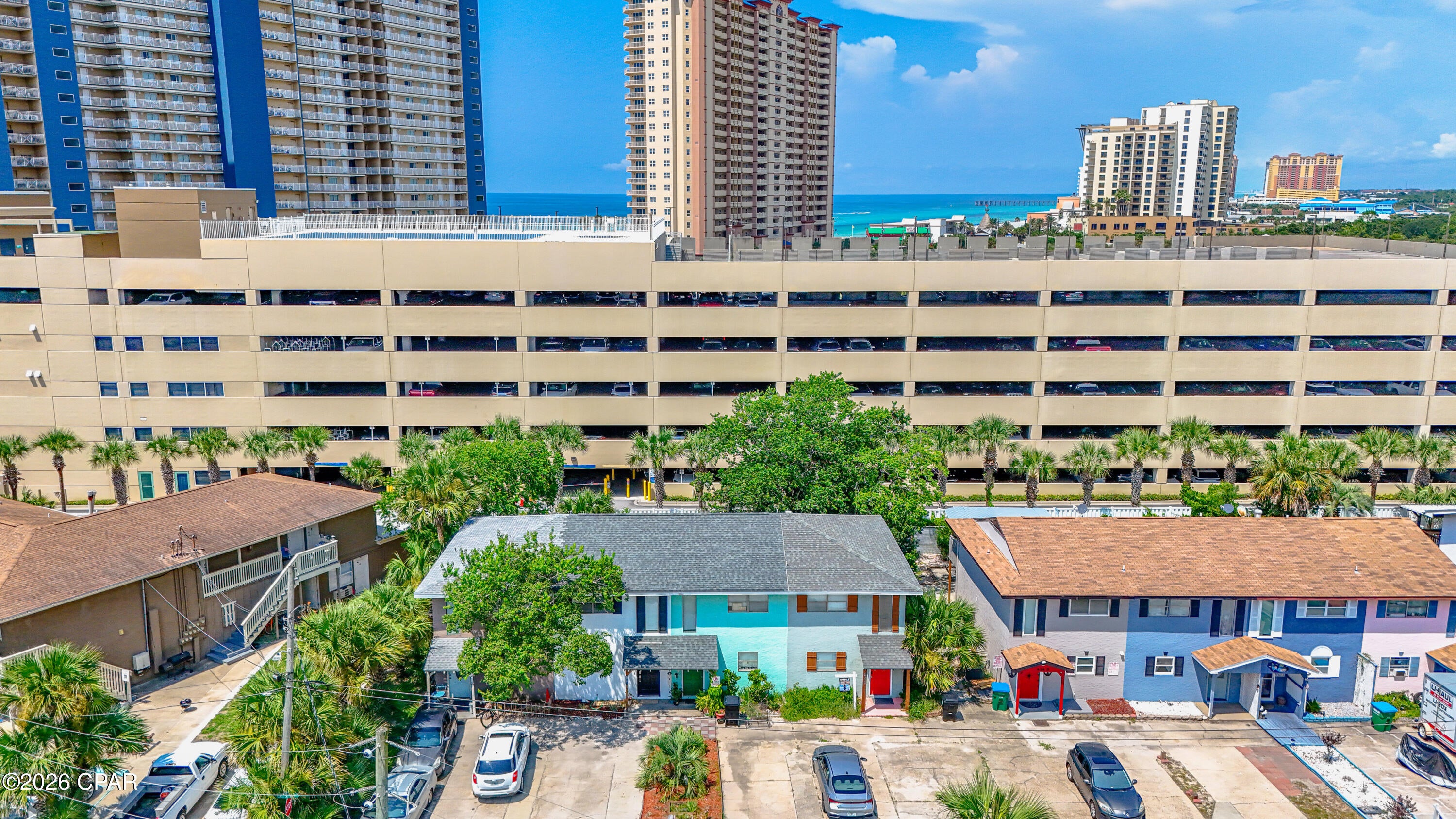 'CURRENTLY UNDER CONTRACT, SELLER WILL CONSIDER BACKUP OFFERS' 
Welcome to your beachside retreat in the heart of Panama City Beach! Located in the desirable Open Sands area and approximately 700 feet from the Gulf, this fully furnished 2-bedroom, 1.5-bath townhome offers the perfect combination of coastal living and investment potential. Short-term rentals are allowed, and with NO HOA, this property provides flexibility whether you're searching for a vacation rental, second home, or full-time residence.

Inside, you'll find an updated, move-in-ready interior featuring vinyl plank and tile flooring, granite countertops, stainless steel appliances, a travertine backsplash, and stylish furnishings throughout. Recent improvements include an updated HVAC system, newer flooring, an updated staircase and railing, new microwave, dryer, dishwasher, décor, and furnishings. The roof was replaced in 2020, adding even more value to this well-maintained property.

Enjoy your morning coffee or evening breeze from the balcony, relax on the open patio or deck, or take a quick golf cart ride to the sugar-white sands and emerald waters of Panama City Beach. A fenced backyard provides additional privacy, while driveway parking makes coming and going easy.

Whether you're looking to expand your rental portfolio or simply want your own place near the beach, this turnkey townhome delivers location, flexibility, and coastal charm. Furnished and ready for its next owner--come experience the Panama City Beach lifestyle!