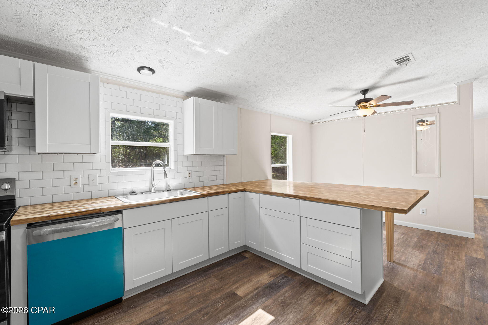 USDA eligible location for 100% financing! Completely renovated home in the desired Juniper Lake Estates. On a spacious and wooded 1 acre parcel. Home has been transformed with new roof, hvac, and nearly everything else. Enter into a bright and airy main space. Wall to wall luxury vinyl plank flooring. A living room and a den with fireplace. New custom cabinetry, butcherblock counters, subway backsplash and a new stainless-steel appliance package. Pantry and a breakfast bar. Master suite features double vanities and extra space for storage or powder station. Guest rooms are nice sized. New front and rear steps. An amazing yard that feels private. Also, a storage container on the property that's included with sale. Ready for a new family. This location qualifies for a USDA loan that has 100% financing. City water. Don't miss this one.