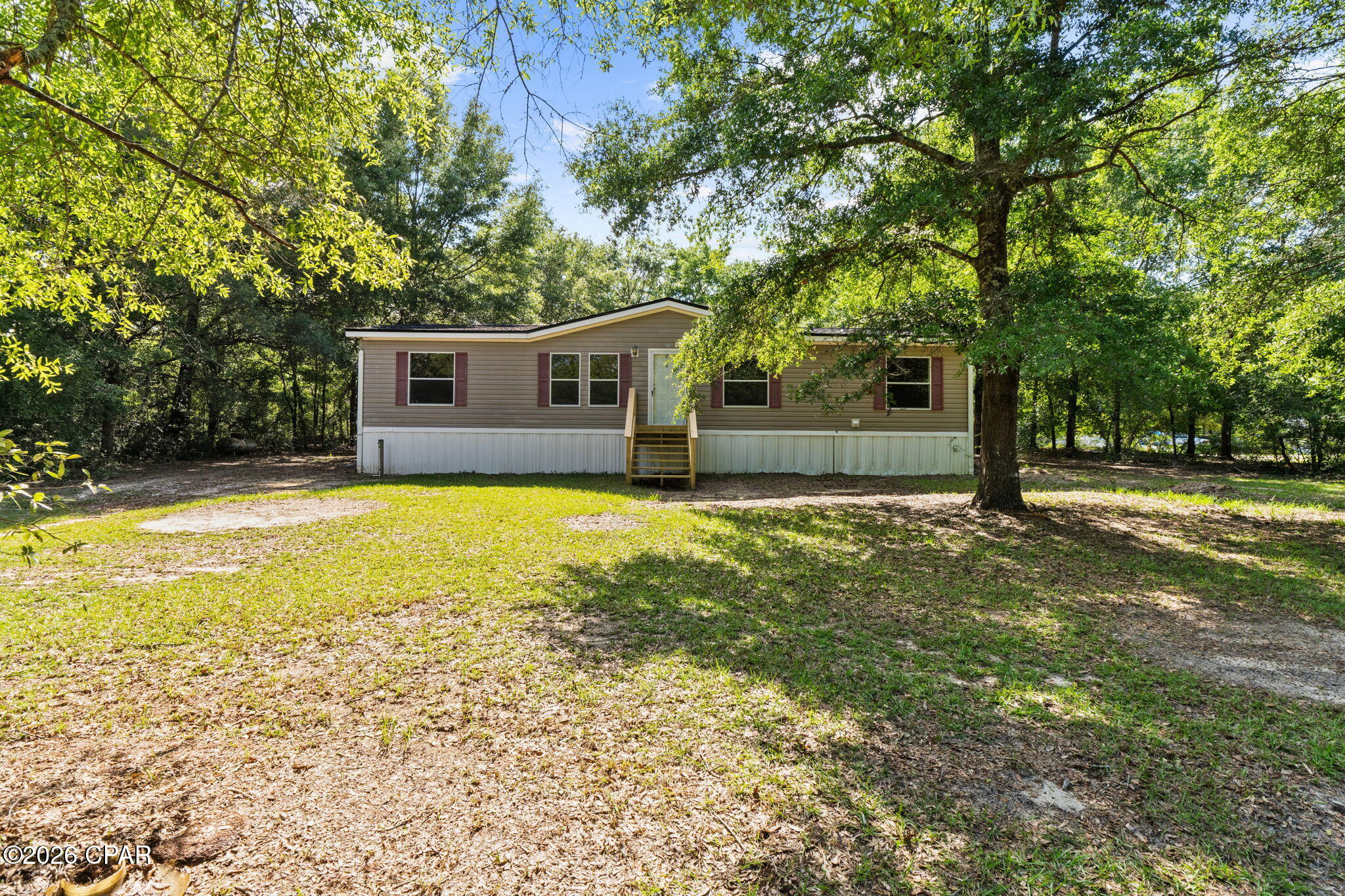 USDA eligible location for 100% financing! Completely renovated home in the desired Juniper Lake Estates. On a spacious and wooded 1 acre parcel. Home has been transformed with new roof, hvac, and nearly everything else. Enter into a bright and airy main space. Wall to wall luxury vinyl plank flooring. A living room and a den with fireplace. New custom cabinetry, butcherblock counters, subway backsplash and a new stainless-steel appliance package. Pantry and a breakfast bar. Master suite features double vanities and extra space for storage or powder station. Guest rooms are nice sized. New front and rear steps. An amazing yard that feels private. Also, a storage container on the property that's included with sale. Ready for a new family. This location qualifies for a USDA loan that has 100% financing. City water. Don't miss this one.