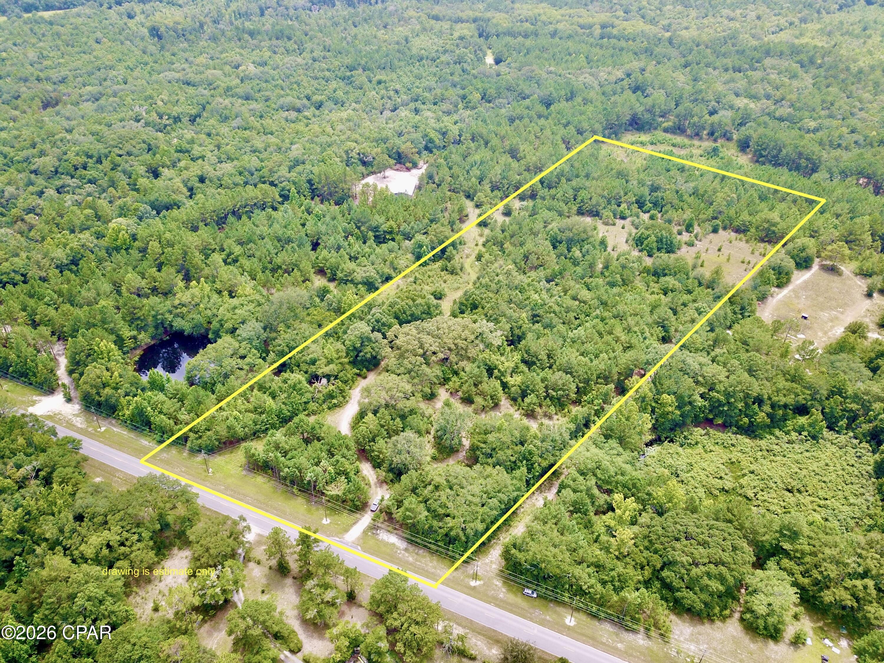 Beautiful piece of land located only 42 miles to the sandy shore of  the Gulf  from this large 11.59 acres of land. close to I 10  in vernon off of 79 .  No Restrictions and already had two septics and two power poles for electric located on property .  This property is wooded but does contain some clearing areas as well. Perfect place to Build , or bring in a manufactured home or two!