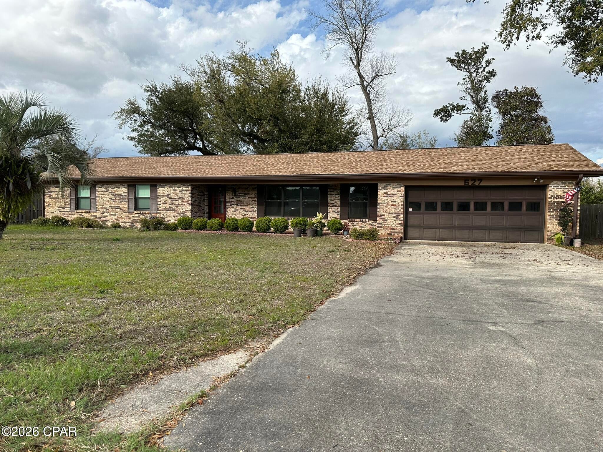 Looking for a home with privacy, space, and timeless charm? This beautifully maintained all-brick 3-bedroom, 2-bath home sits behind a fully fenced backyard, creating the perfect setting for kids, pets, entertaining, or simply unwinding after a long day. Enjoy peaceful mornings in the Florida room with a cup of coffee while taking in the quiet surroundings.

Inside, you'll find a versatile floor plan featuring two spacious living areas and a dedicated dining room, offering plenty of room to host holidays, game nights, or family gatherings. The updated kitchen is equipped with granite countertops, stainless steel appliances, generous cabinet storage, and ample prep space to make cooking both easy and enjoyable.

The private primary suite is generously sized and features two closets along with an updated ensuite bathroom complete with a walk-in shower. Two additional bedrooms provide comfortable accommodations for family, guests, or a home office and share a well-appointed second full bathroom.

Additional features include a walk-in pantry, a dedicated laundry area with built-in cabinetry, and an oversized two-car garage with extra room for storage or hobbies.

Conveniently located less than 10 minutes from Tyndall Air Force Base, this home also offers quick access to shopping, local restaurants, parks, public boat ramps, and everyday conveniences. If you've been searching for a move-in-ready home that combines comfort, functionality, and an excellent location, this is one you won't want to miss.