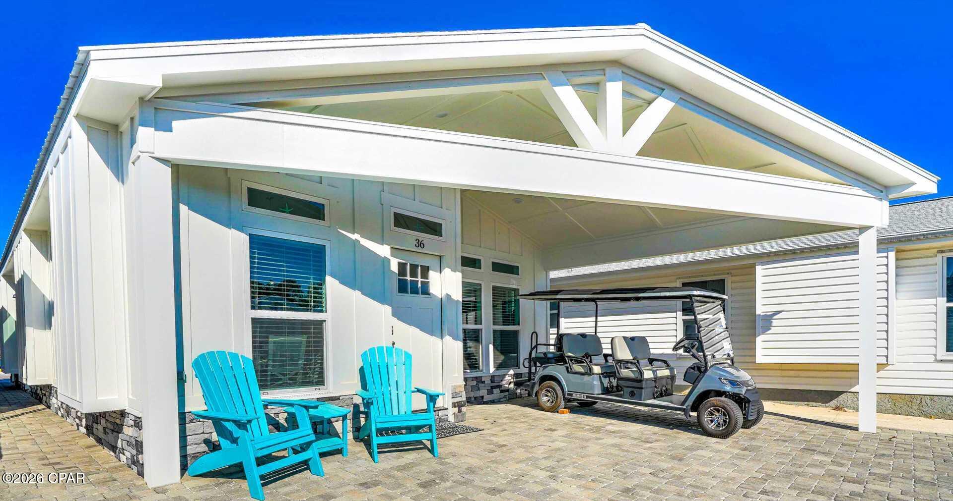 Welcome to your perfect beach getaway and income-producing investment in the highly sought-after gated community of Venture Out. This beautifully designed 3 bedroom, 2 bath home offers the ideal combination of modern coastal style, functionality, and proven rental performance--with stellar rental history and bookings already secured for 2026.

Step inside to an inviting open-concept floor plan featuring vaulted ceilings, abundant natural light, and luxury vinyl plank flooring throughout. The spacious living area flows seamlessly into a well-appointed kitchen complete with white shaker cabinetry, stainless steel appliances, solid surface countertops, and a large island with bar seating--perfect for entertaining guests or relaxing after a day at the beach.

The primary suite offers a peaceful retreat, while two additional bedrooms provide ample space for family, guests, or rental flexibility. Both bathrooms are tastefully finished with modern coastal touches.

A standout feature of this home is the dedicated laundry room, which includes an additional full-size refrigerator--ideal for storing extra beverages, groceries, or accommodating large groups and vacation renters.

Outside, enjoy a welcoming covered front porch and low-maintenance exterior, perfect for enjoying the coastal breeze. Located just steps from the beach and all the amenities Venture Out has to offer, including pools, fishing pier, boat ramp, tennis courts, and 24-hour gated security.

Whether you're looking for a primary residence, vacation home, or high-performing rental property, this home checks every box. With strong rental income history and future bookings already in place, this is a turnkey opportunity you don't want to miss.